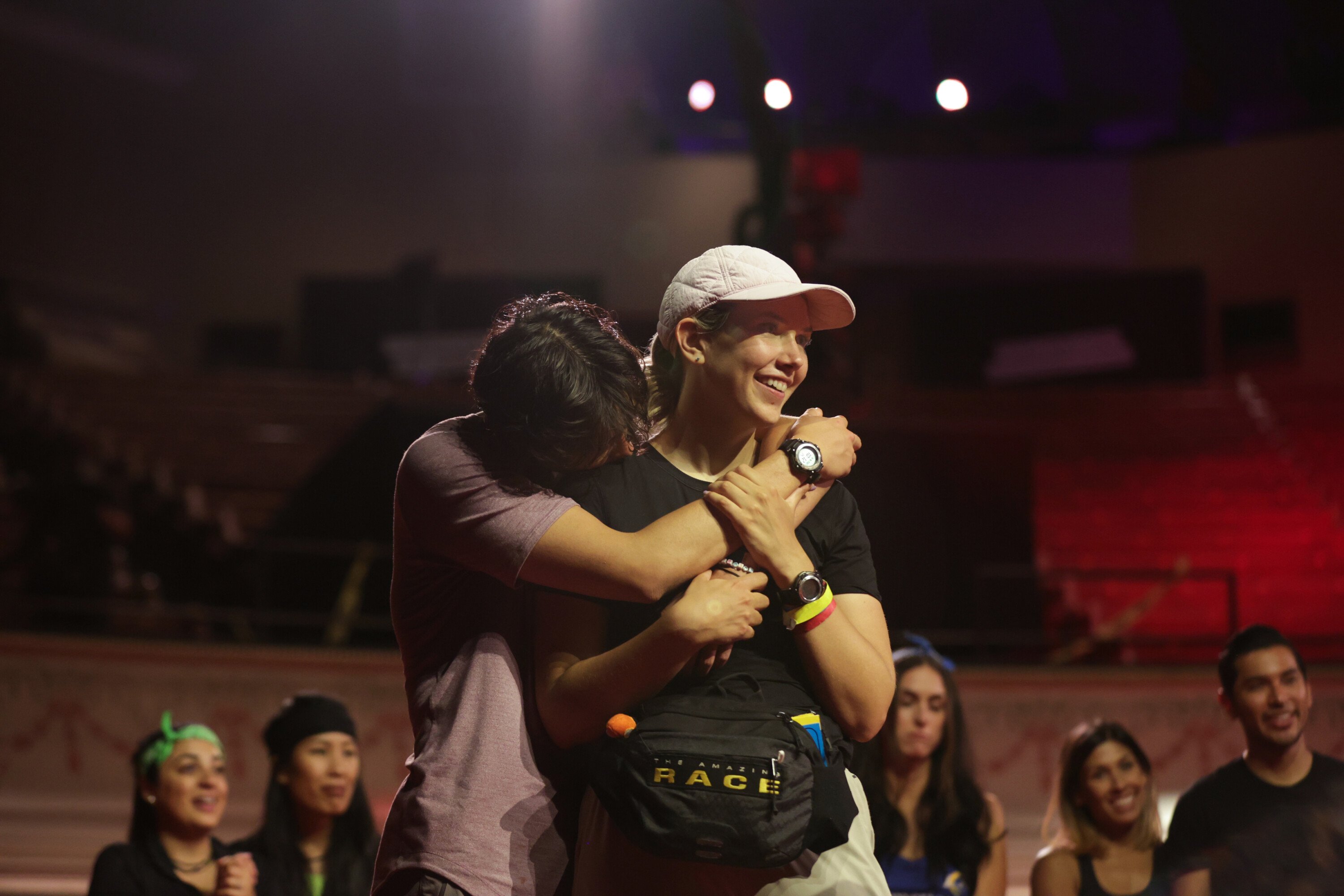 Derek Xiao and Claire Rehfuss, who starred in 'The Amazing Race' Season 34 on CBS, embrace at the finish line.