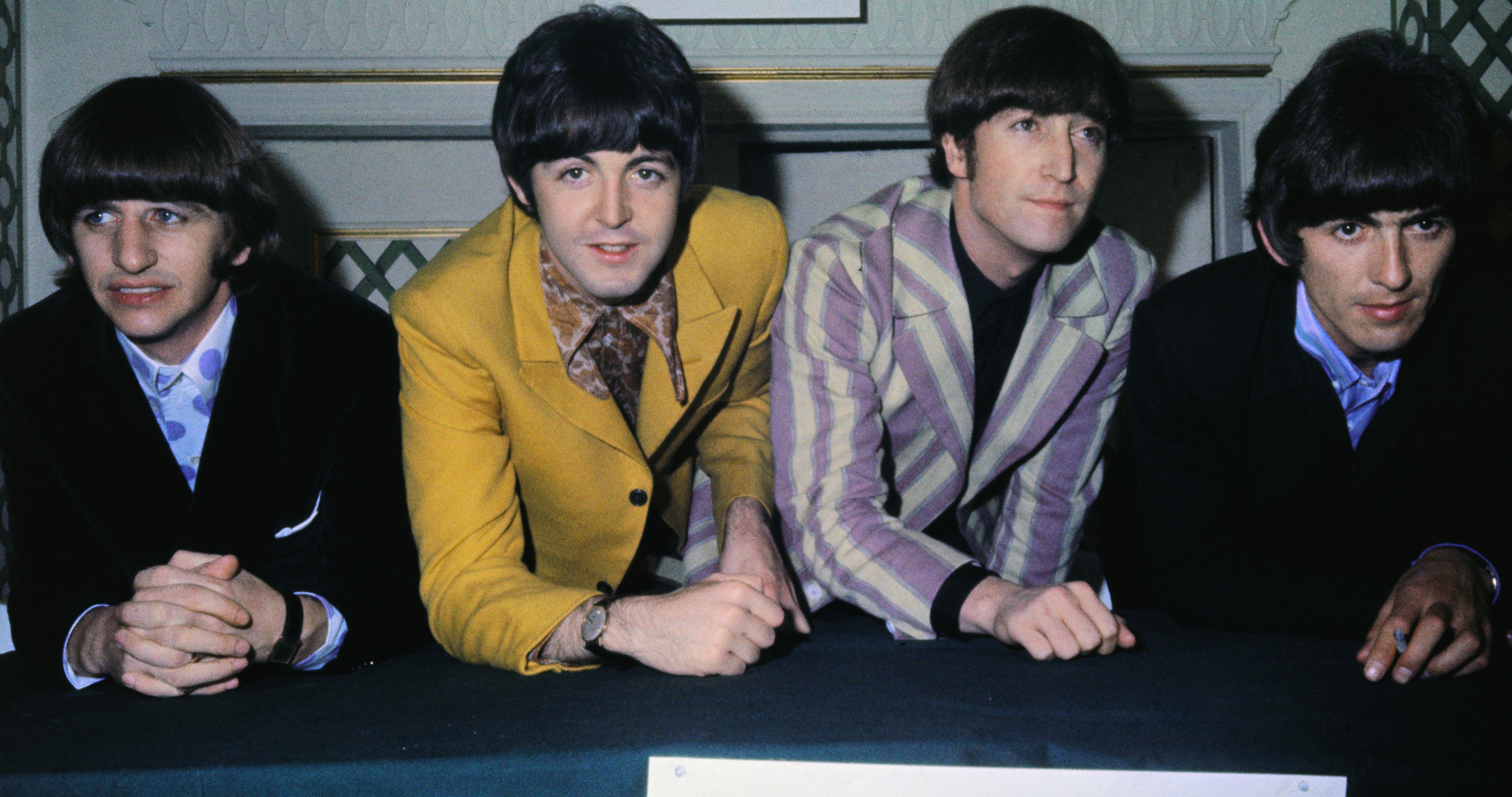 The Beatles at a table during their "Ob-La-Di, Ob-La-Da" era