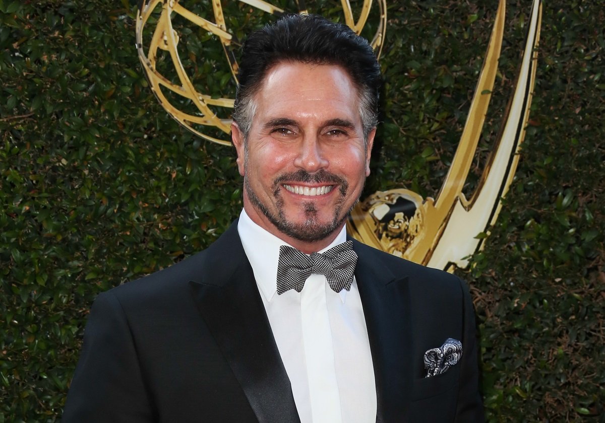 'The Bold and the Beautiful' star Don Diamont wearing a tuxedo and standing in front of an Emmy statue.
