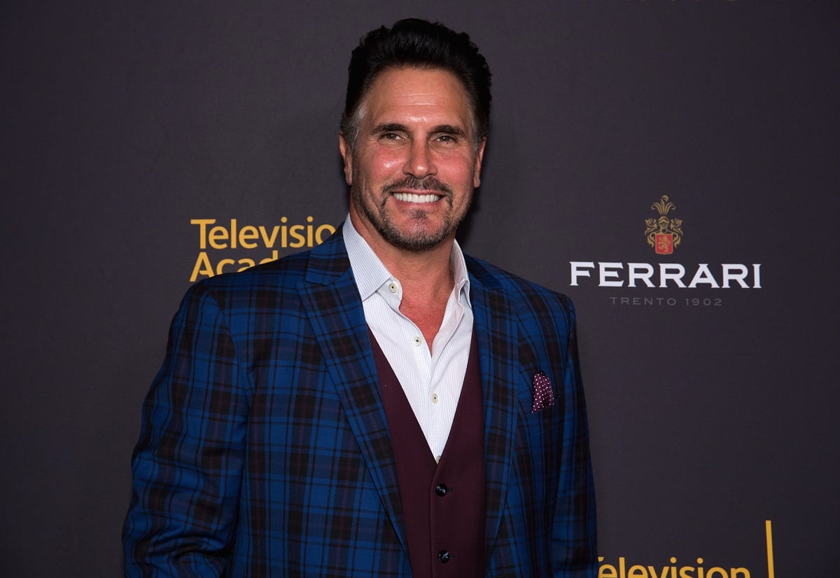 'The Bold and the Beautiful' star Don Diamont wearing a blue plaid suit; smiles during a red carpet appearance.