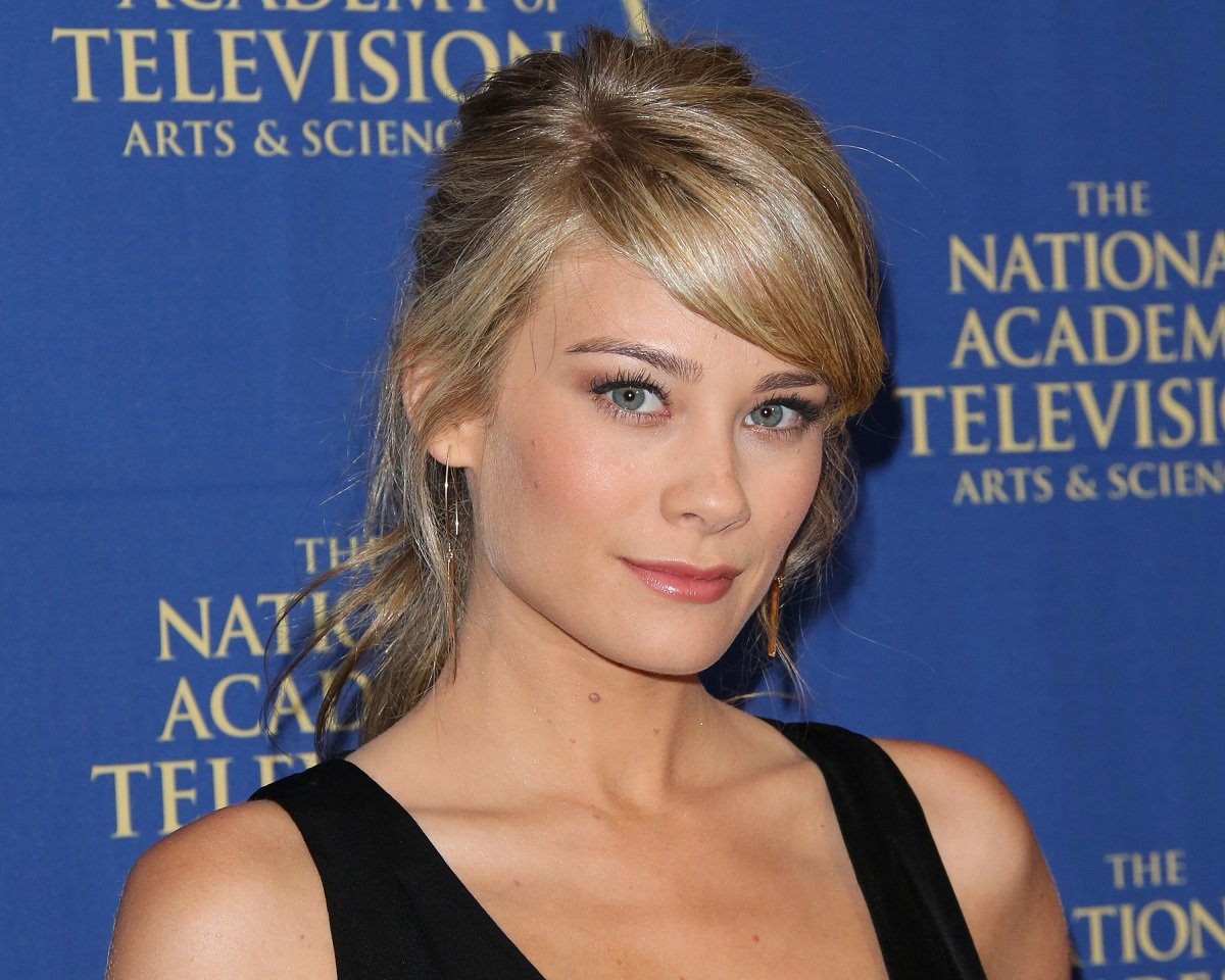 'The Bold and the Beautiful' star Kim Matula wearing a black dress and posing during a red carpet appearance.