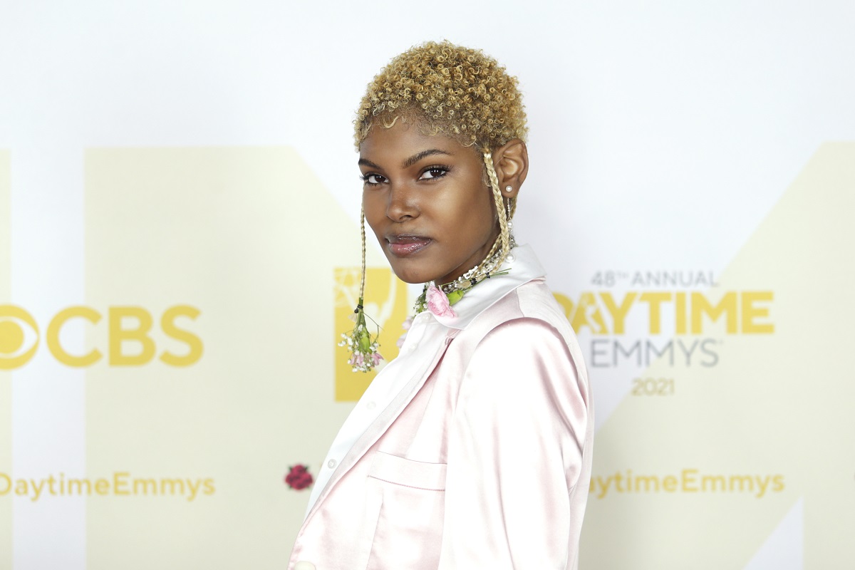 'The Bold and the Beautiful' star Diamond White wearing a light pink suit; poses on the red carpet of the Daytime Emmys.