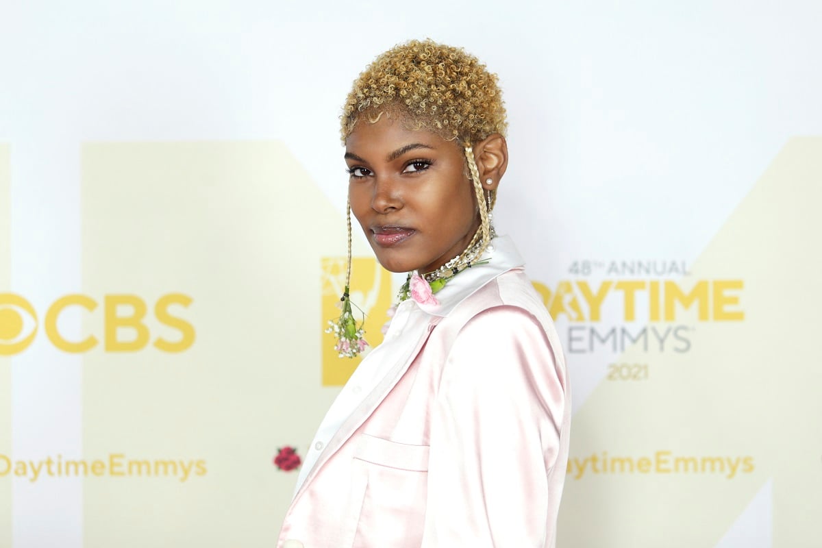 'The Bold and the Beautiful' star Diamond White wearing a light pink suit; poses on the red carpet of the Daytime Emmys.