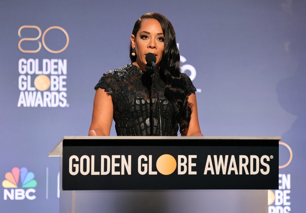 'Lopez vs. Lopez' star Selenis Leyva in a black dress; stands at a podium to announce the 2023 Golden Globe nominations.