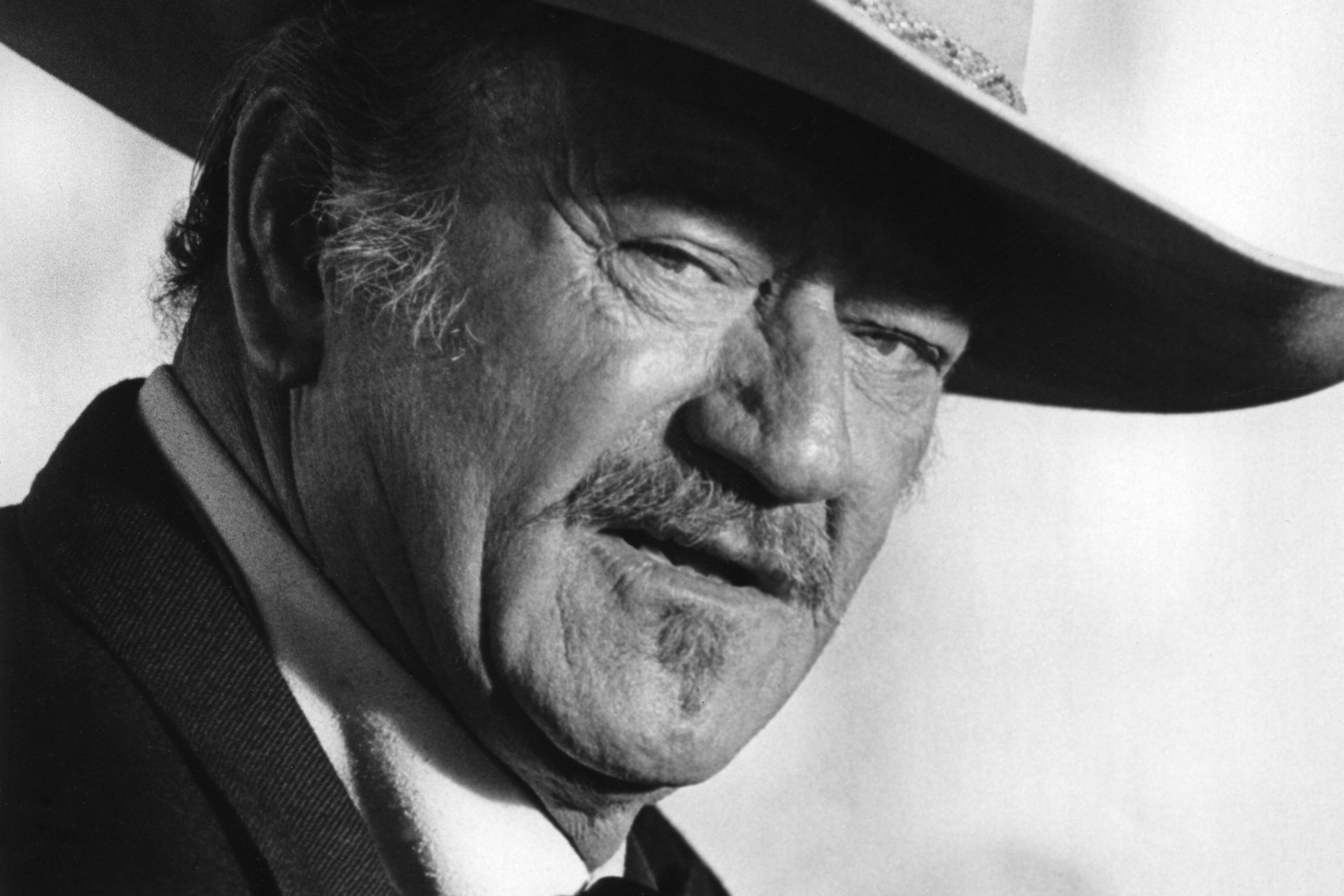 'The Shootist' John Wayne as J.B. Books in a black-and-white picture wearing a cowboy hat
