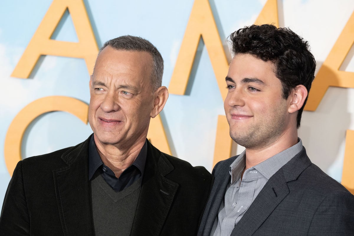 Tom Hanks and Truman Hanks smile at the A Man Called Otto photo call