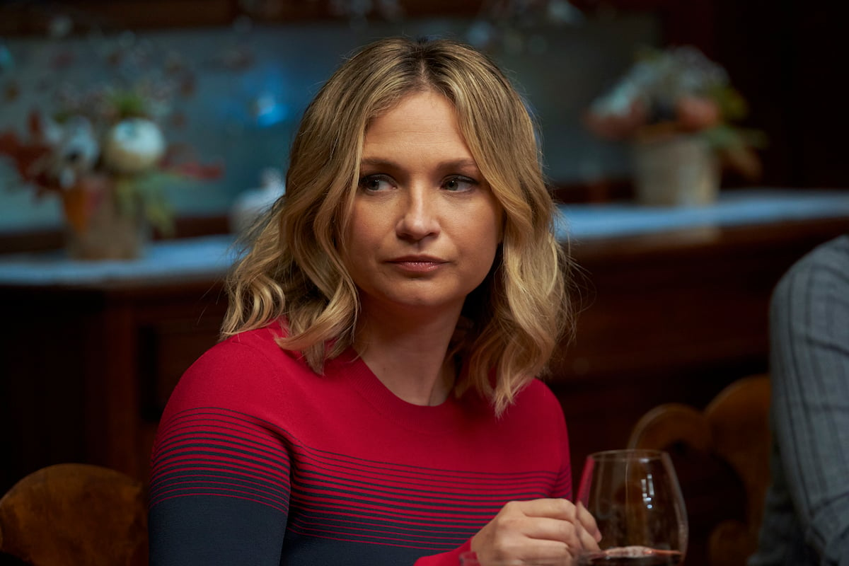 Vanessa Ray as Officer Eddie Janko in a family dinner scene in'Blue Bloods'