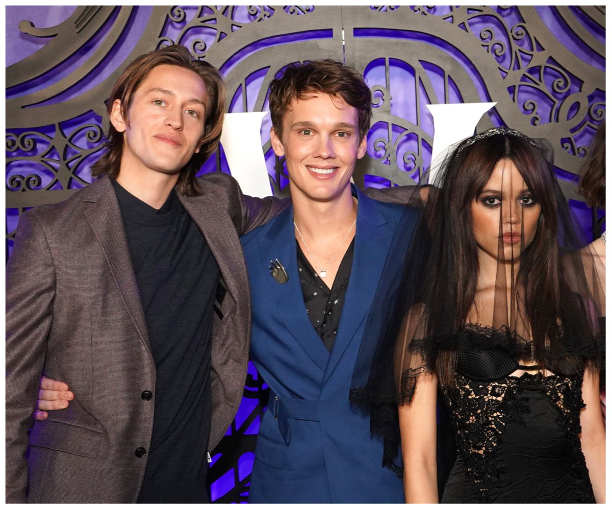 "Wednesday" stars Percy Hynes White, Hunter Doohan, and Jenna Ortega pose together at an event.