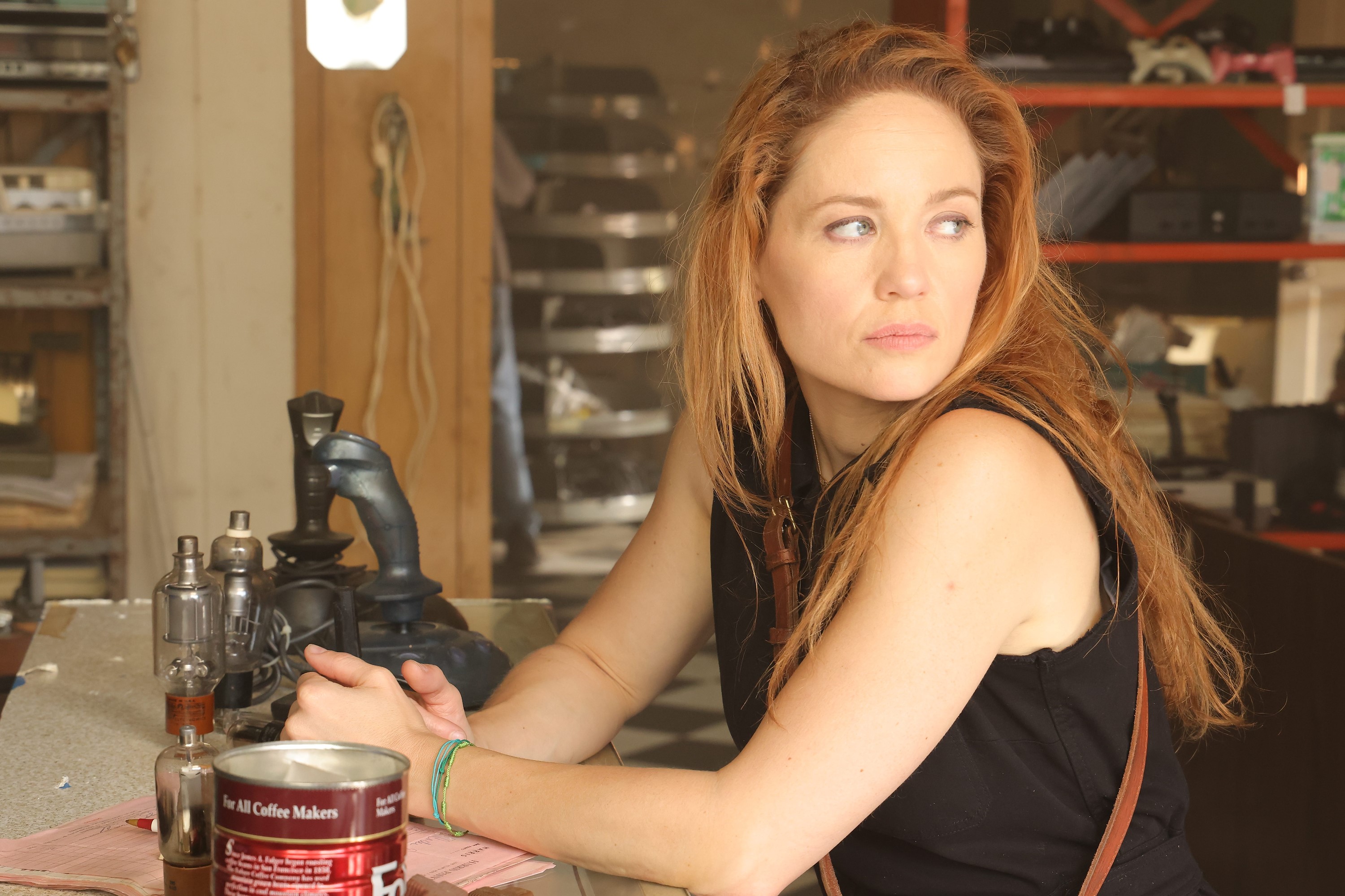 Erika Christensen, in character as Angie Polaski in 'Will Trent' on ABC, wears a black tank top.