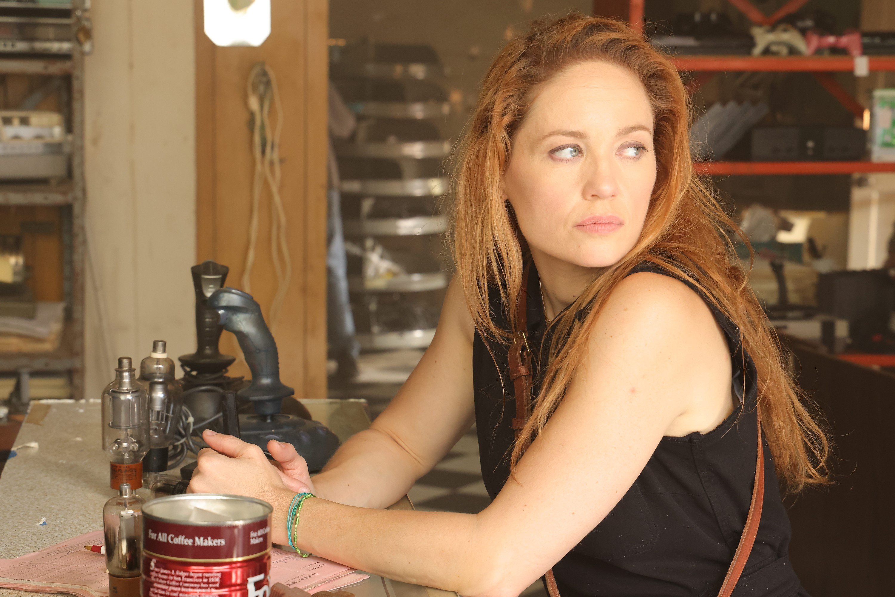 Erika Christensen, in character as Angie Polaski in 'Will Trent' on ABC, wears a black tank top.