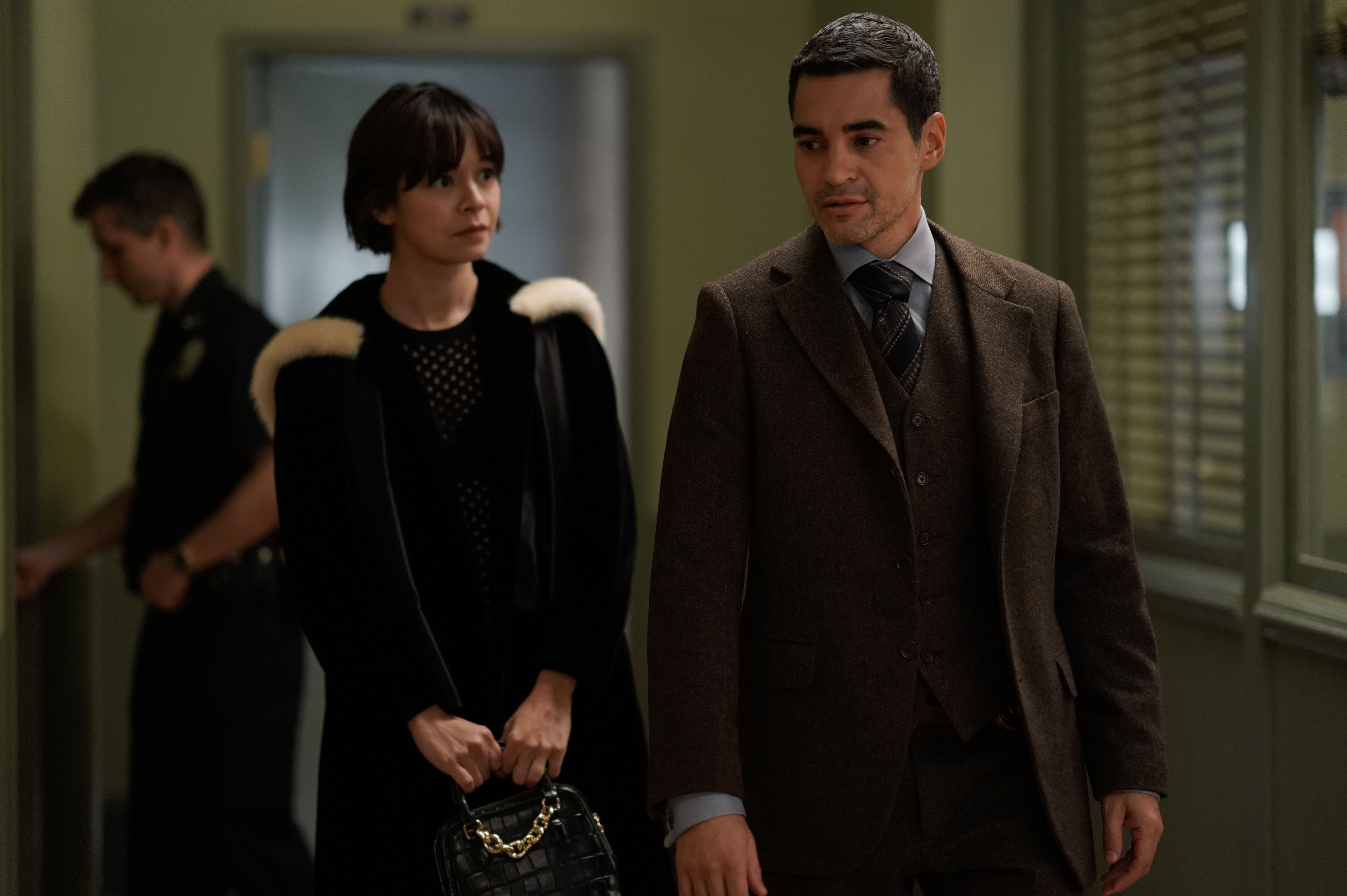 Julia Chan as Ava Green and Ramón Rodríguez as Will Trent in 'Will Trent' Season 1 Episode 5 on ABC. Ava wears a black coat. Will wears a brown three-piece suit.