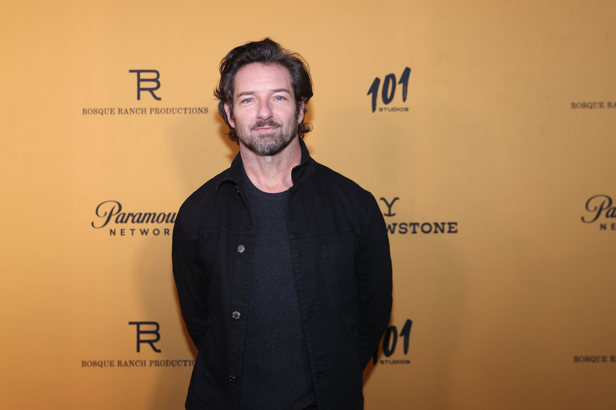 'Yellowstone': Ian Bohen stands wiht his hands behind his back