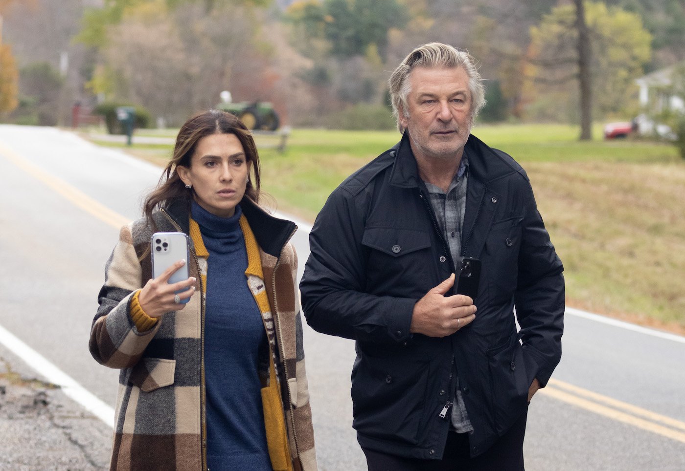 Hilaria Baldwin and Alec Baldwin stand arm in arm