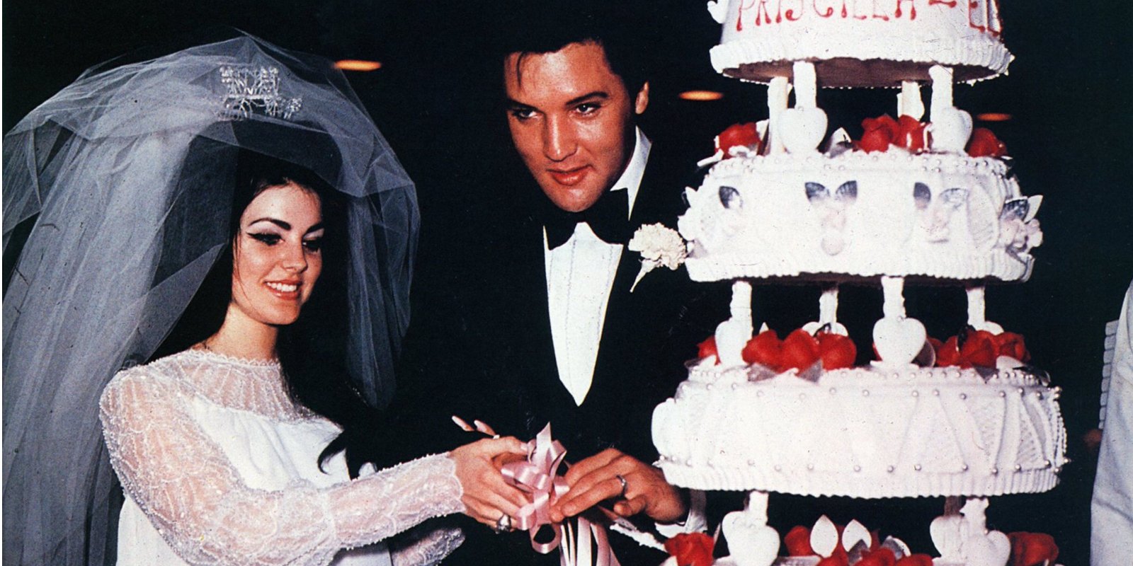Priscilla and Elvis Presley cut their wedding cake in Las Vegas in May 1967.