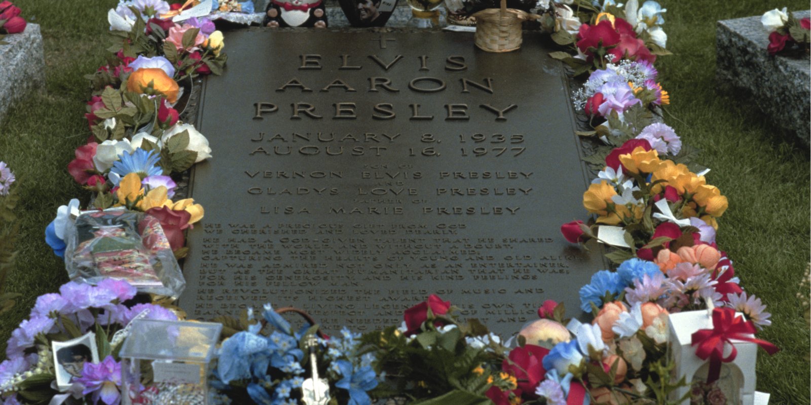 Elvis Presley's tombstone located at Graceland in Memphis, TN.