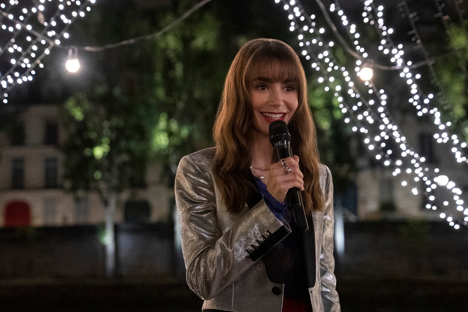 Lily Collins as Emily Cooper singing Alfie in Emily in Paris Season 3.