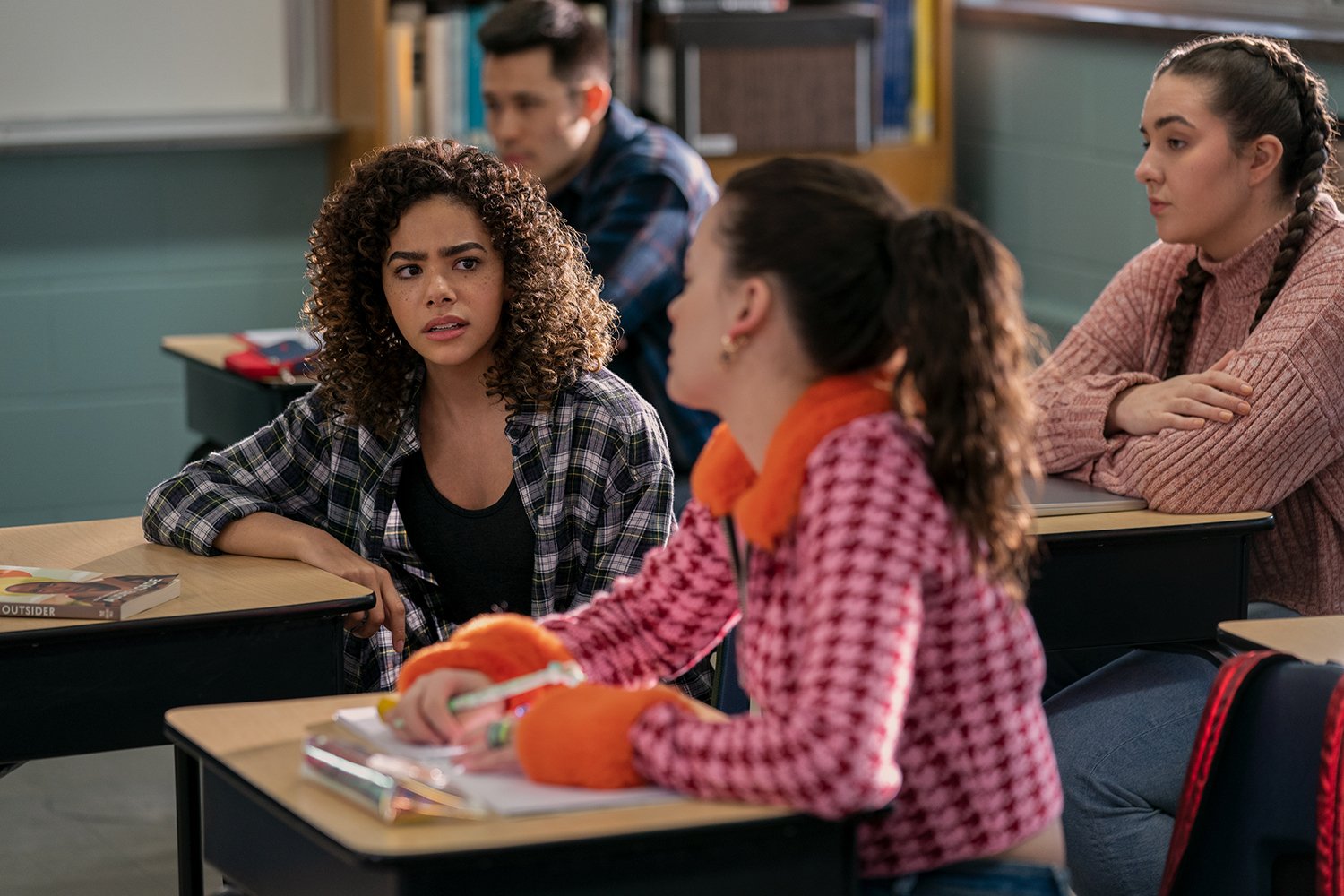 Ginny & Georgia Season 2: Antonia Gentry's Ginny and Sara Waisglass's Max sit beside each other in a classroom as Ginny looks at Max with a disgusted expression.