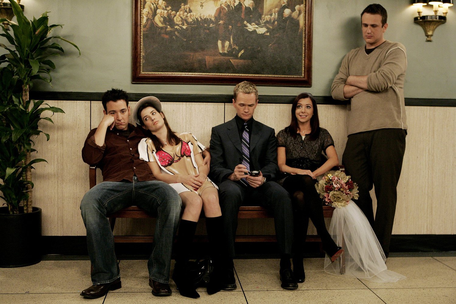 How I Met Your Mother: Josh Radnor as Ted, Cobie Smulders as Robin, Neil Patrick Harris as Barney, Alyson Hannigan as Lily, and Jason Segel as Marshall waiting on a bench in Atlantic City