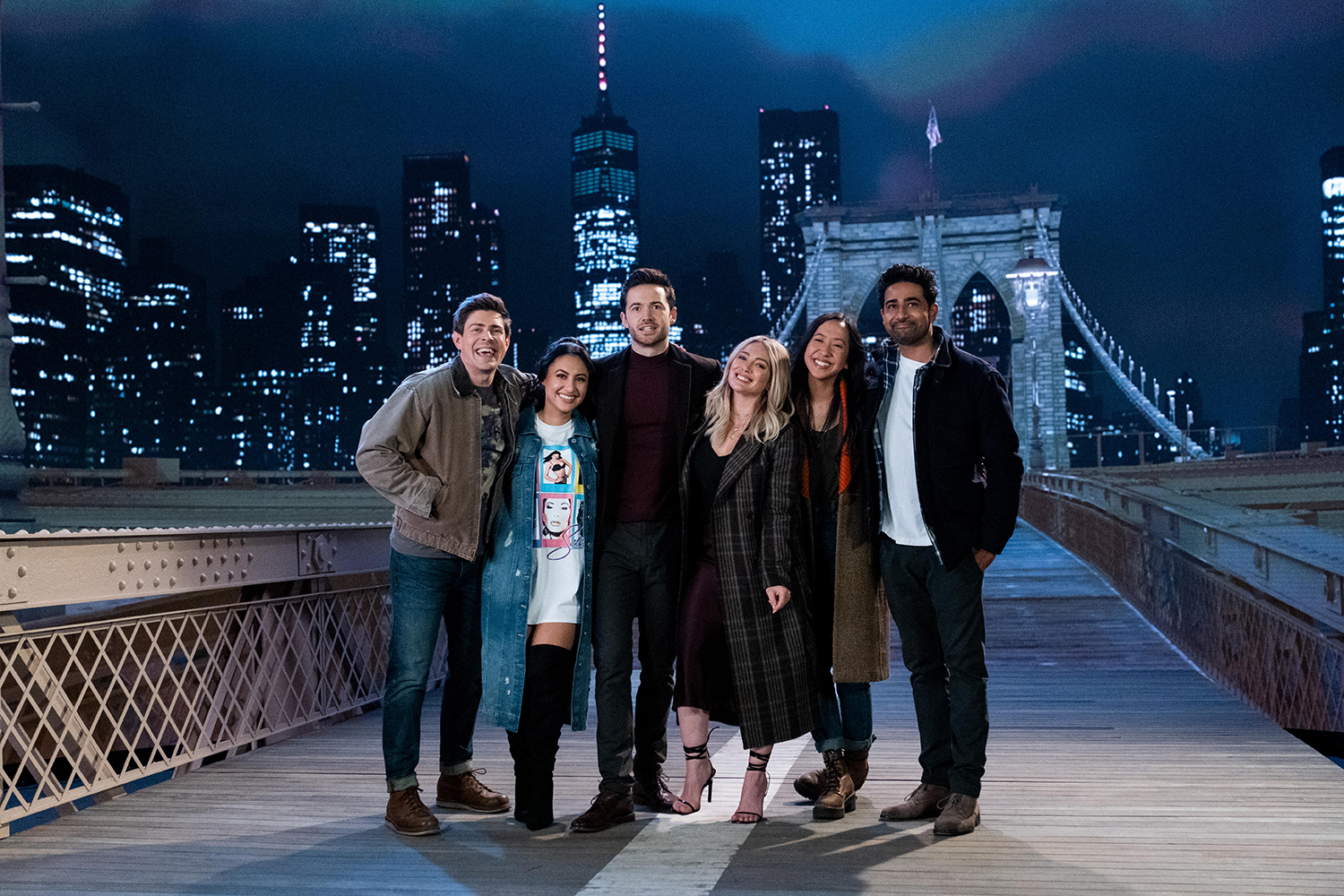 How I Met Your Father stars Chris Lowell, Francia Raisa, Tom Ainsley, Hilary Duff, Tien Tran, and Suraj Sharma on a recreation of the Brooklyn Bridge