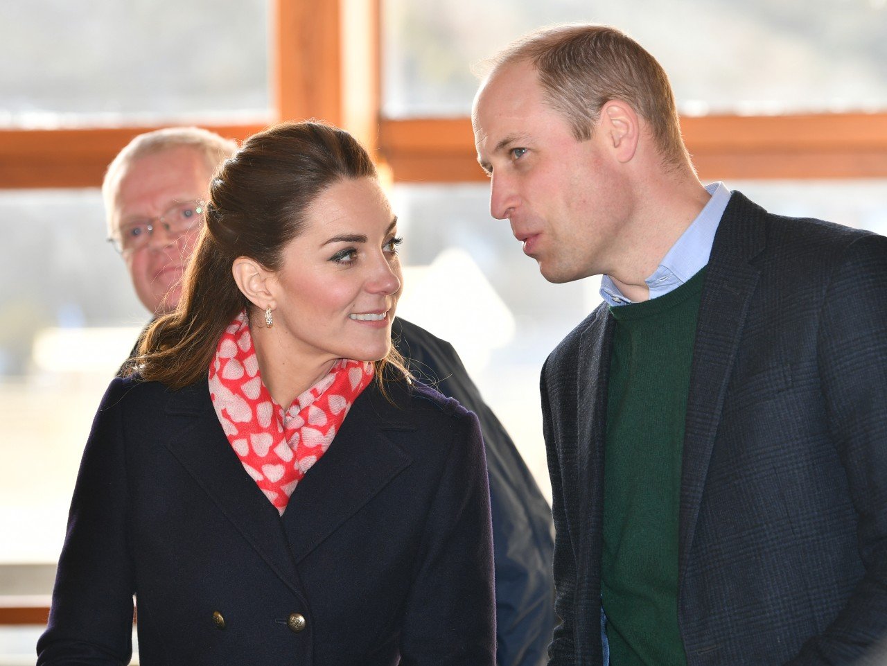Kate Middleton and Prince William talk together. 