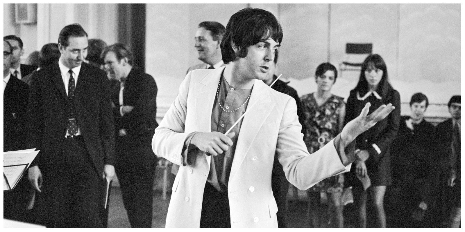 Paul McCartney of The Beatles, conducts the Black Dyke Mills Band, recording a record, Thingmebob, written by Paul for a new television series, at the Victoria Hall, Saltaire, Yorkshire, 30th June 1968.