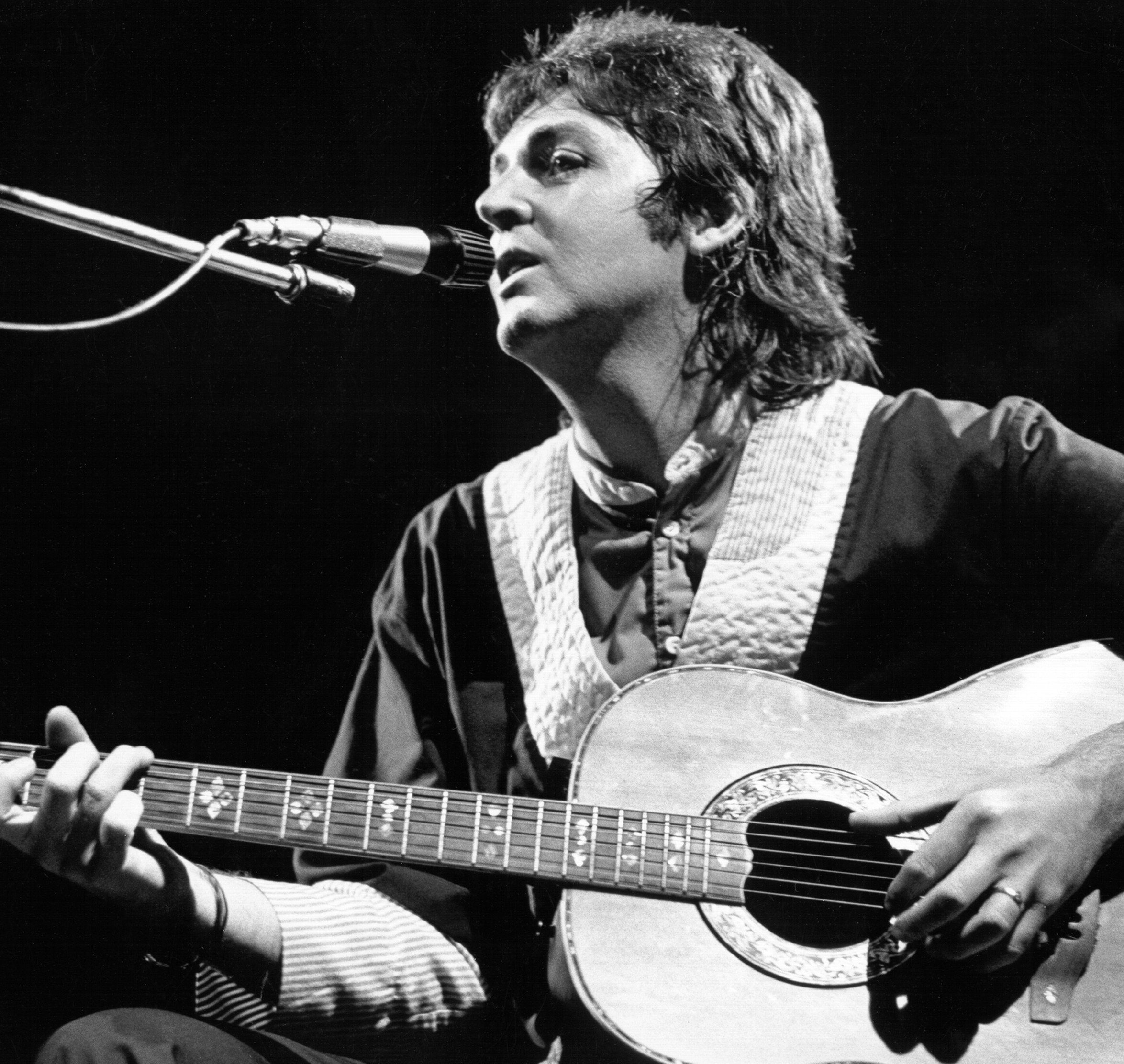 Paul McCartney with a guitar during the "Band on the Run" era