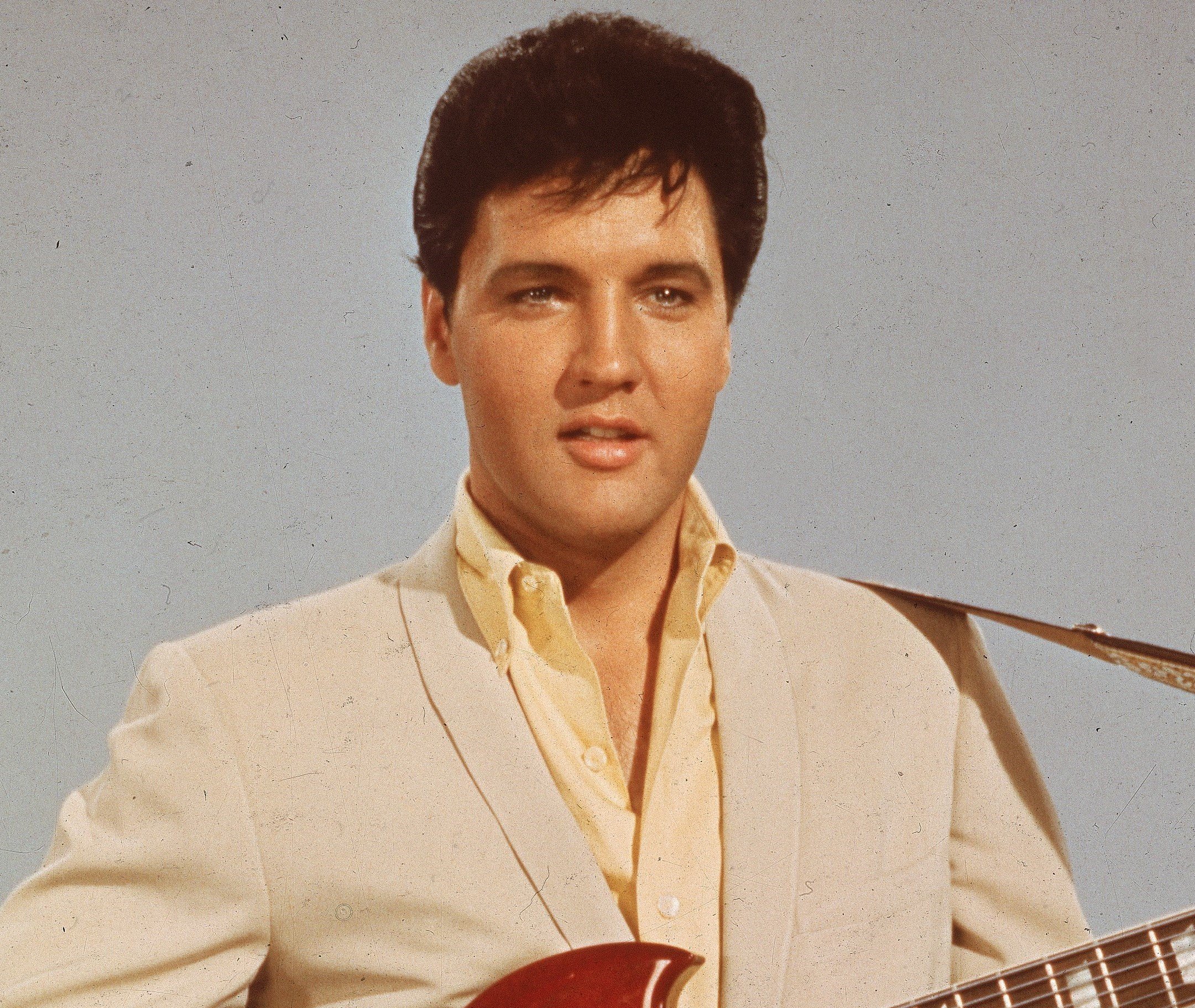 Elvis Presley wearing white
