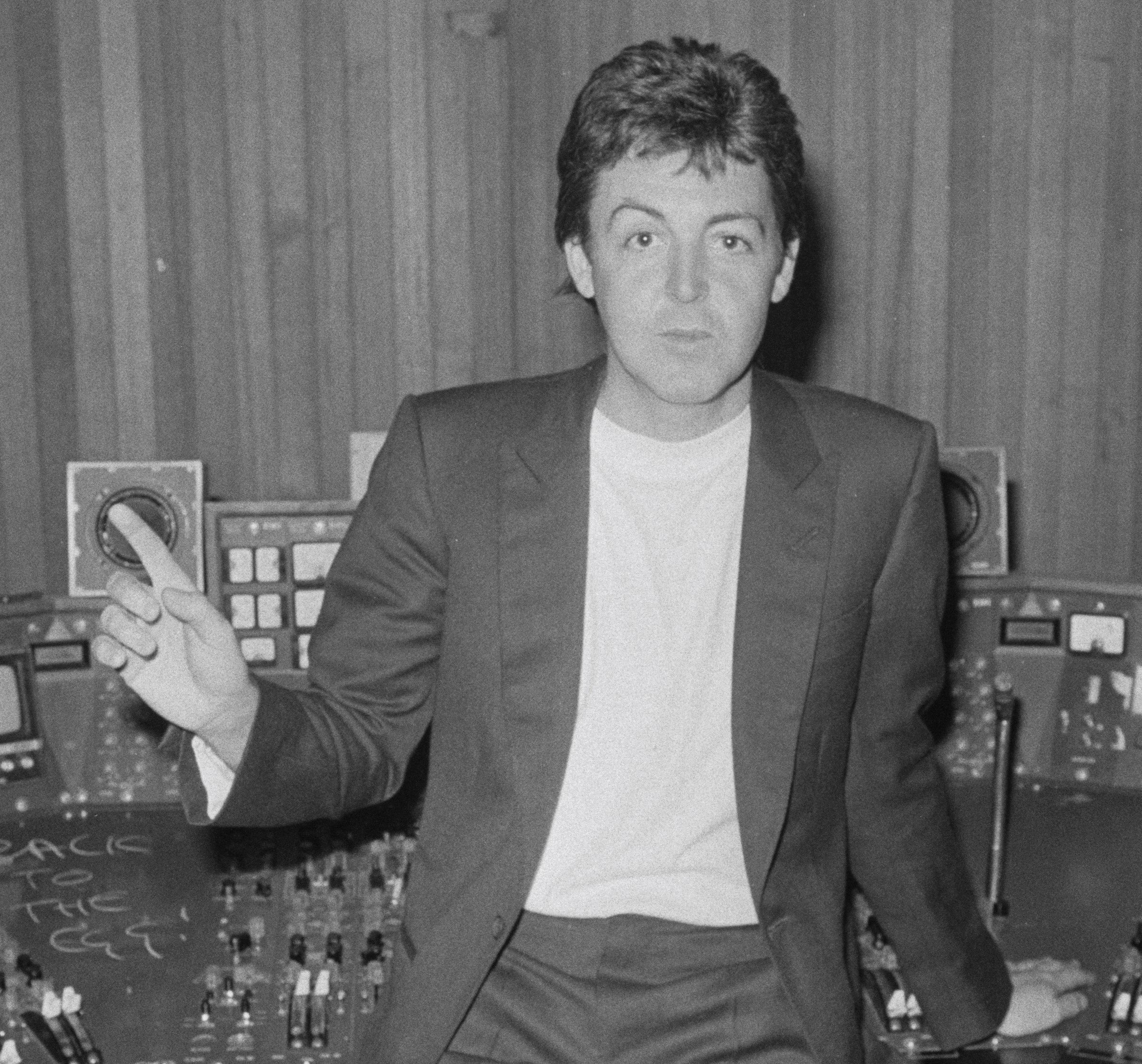 Paul McCartney raising a finger