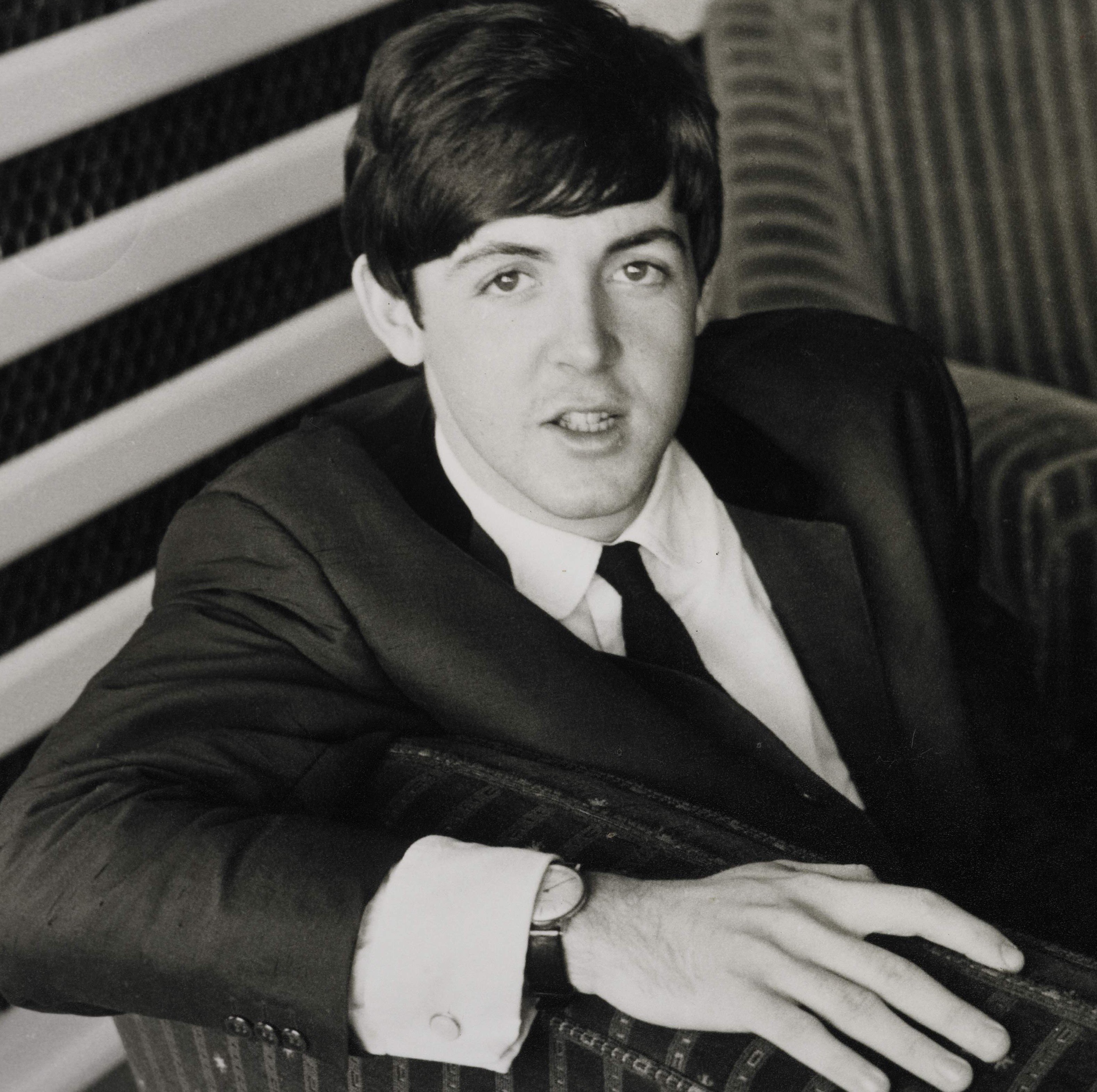 Paul McCartney in a chair