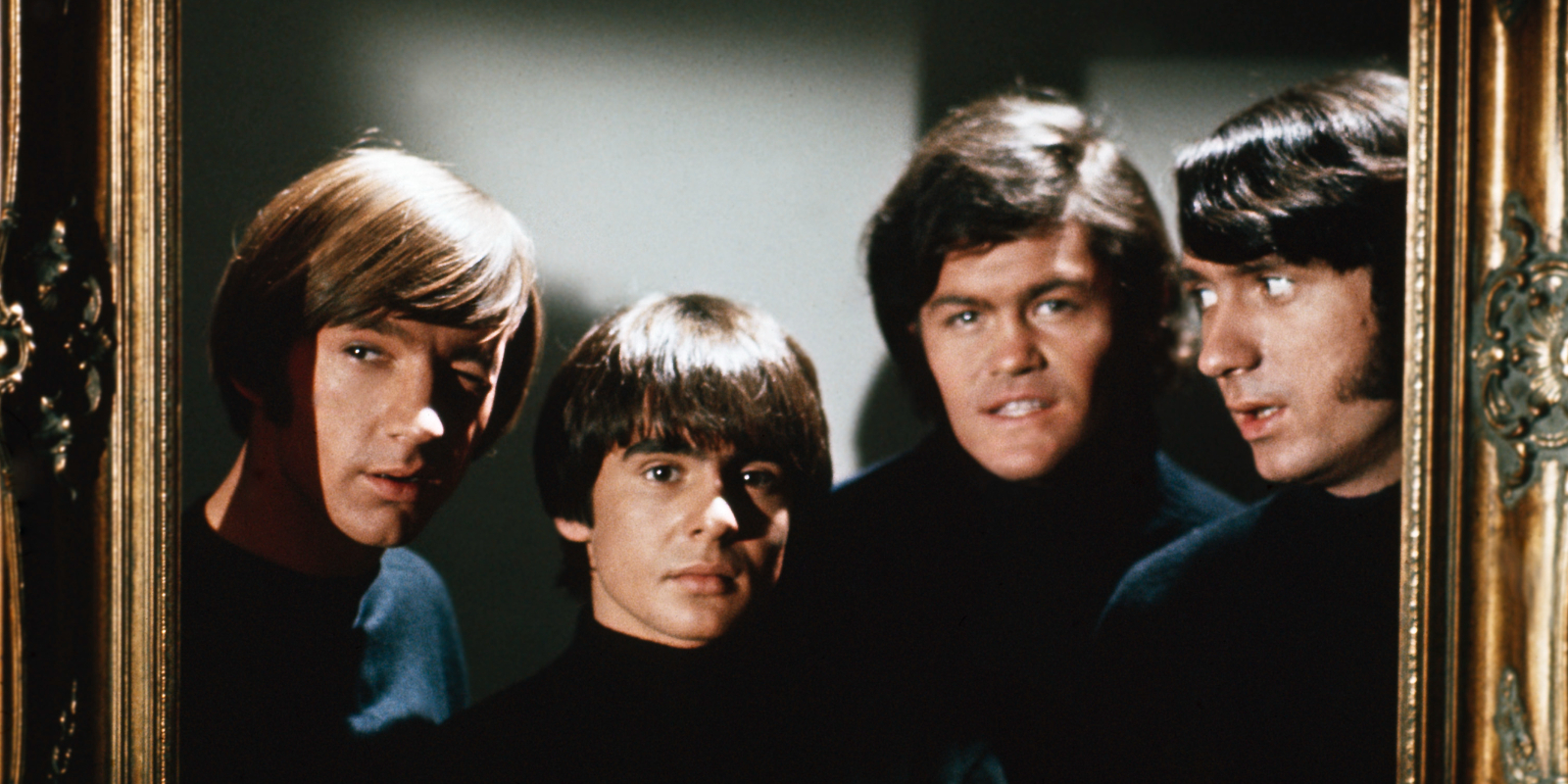 Peter Tork, Davy Jones, Micky Dolenz, and Mike Nesmith on the set of 'The Monkees' television show in the late 1960s.