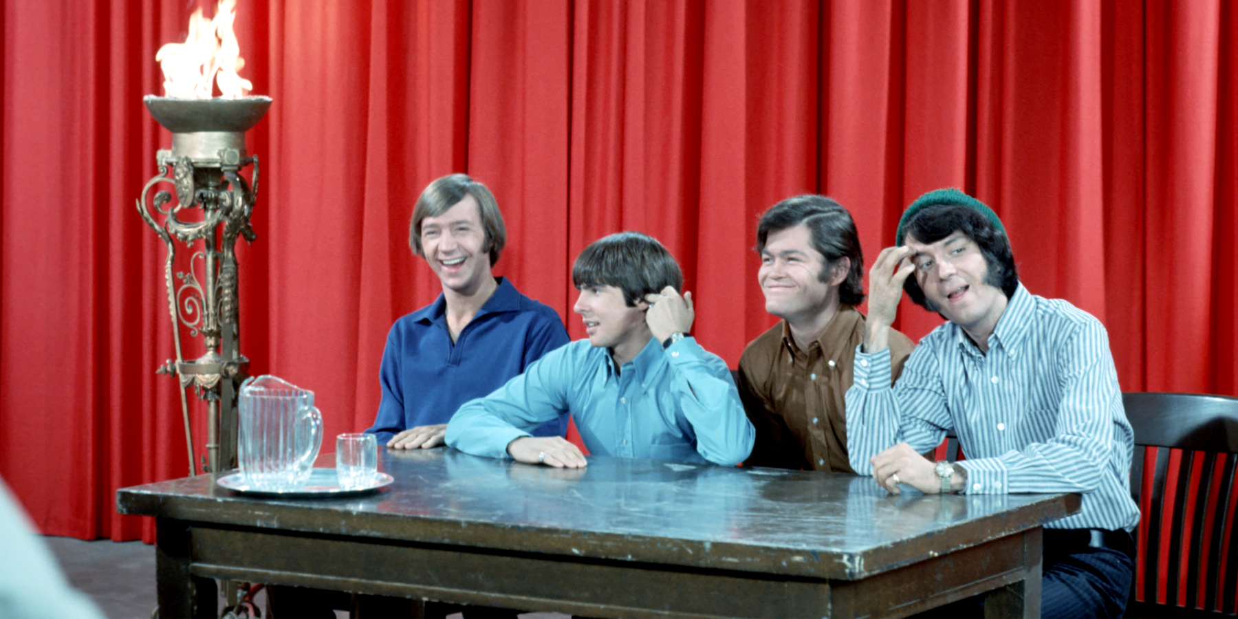 Peter Tork, Davy Jones, Micky Dolenz, and Mike Nesmith on the set of 'The Monkees' television show in the late 1960s.