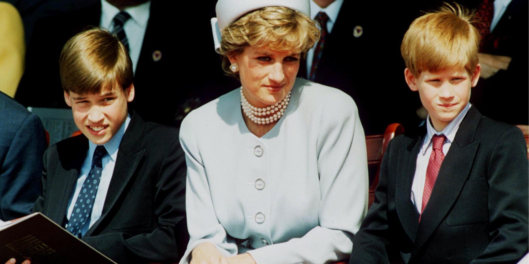 Prince William, Princess Diana and Prince Harry in a paparazzi photograph.