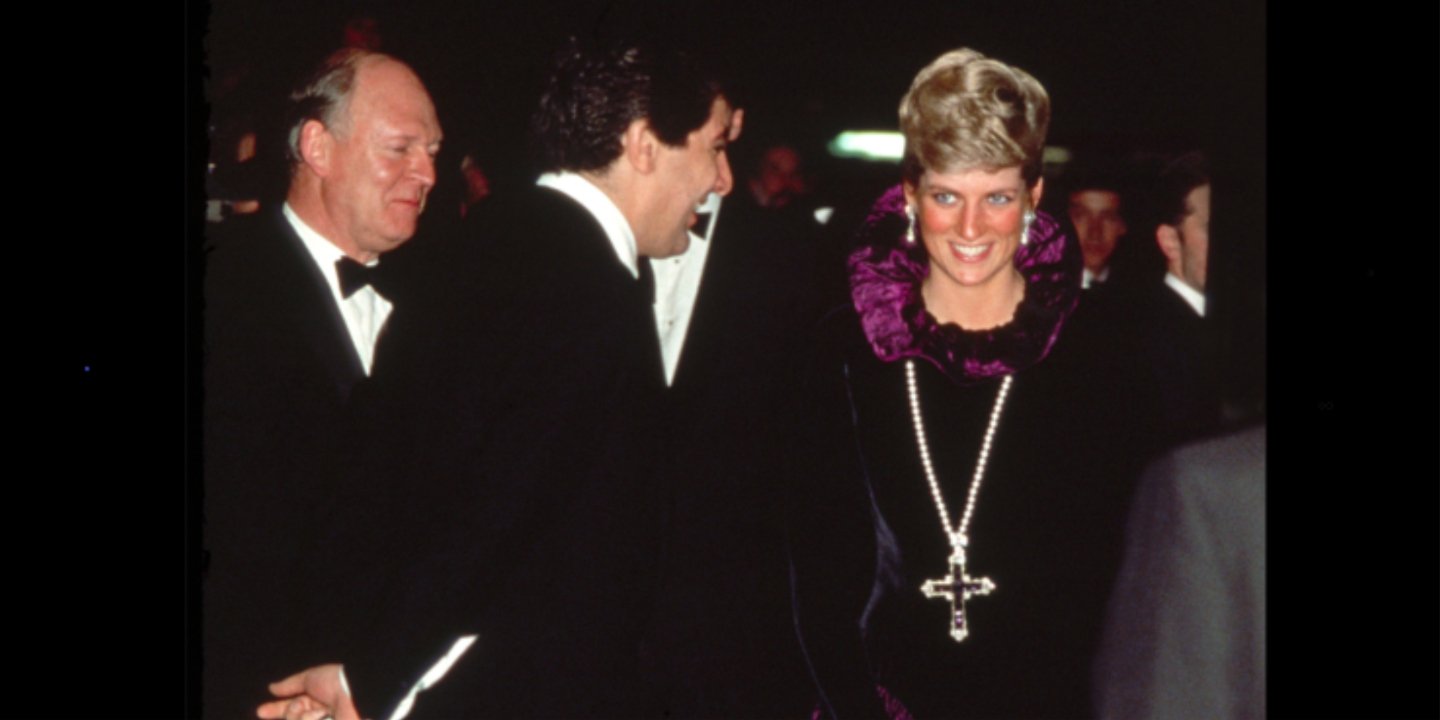 Arriving at a Charity Gala Evening On Behalf Of Birthright At Garrard. The Princess Is Wearing A Purple Evening Dress With A Gold And Amethyst Crucifix Suspended On A Pearl Rope.