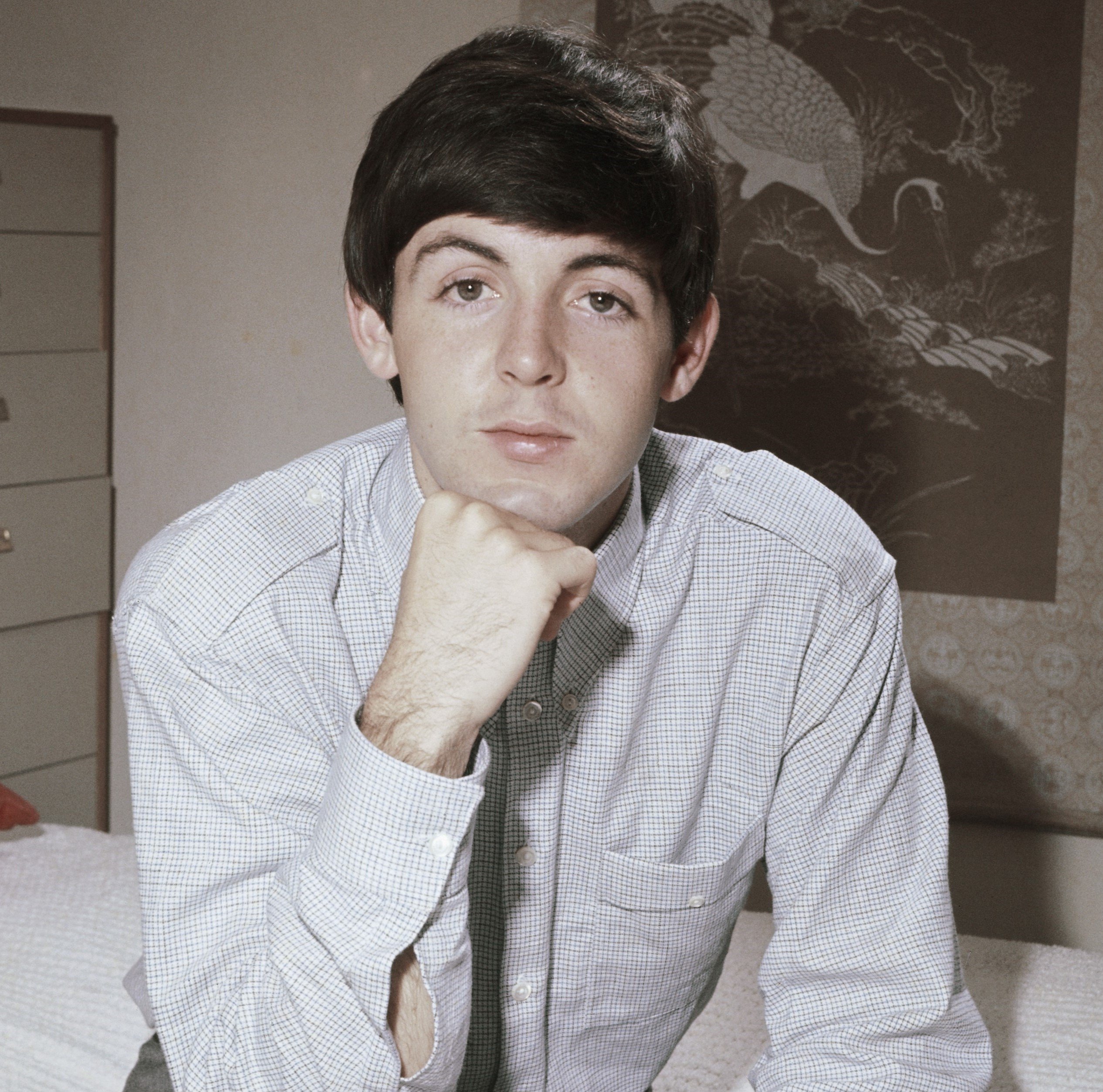 Paul McCartney on a bed