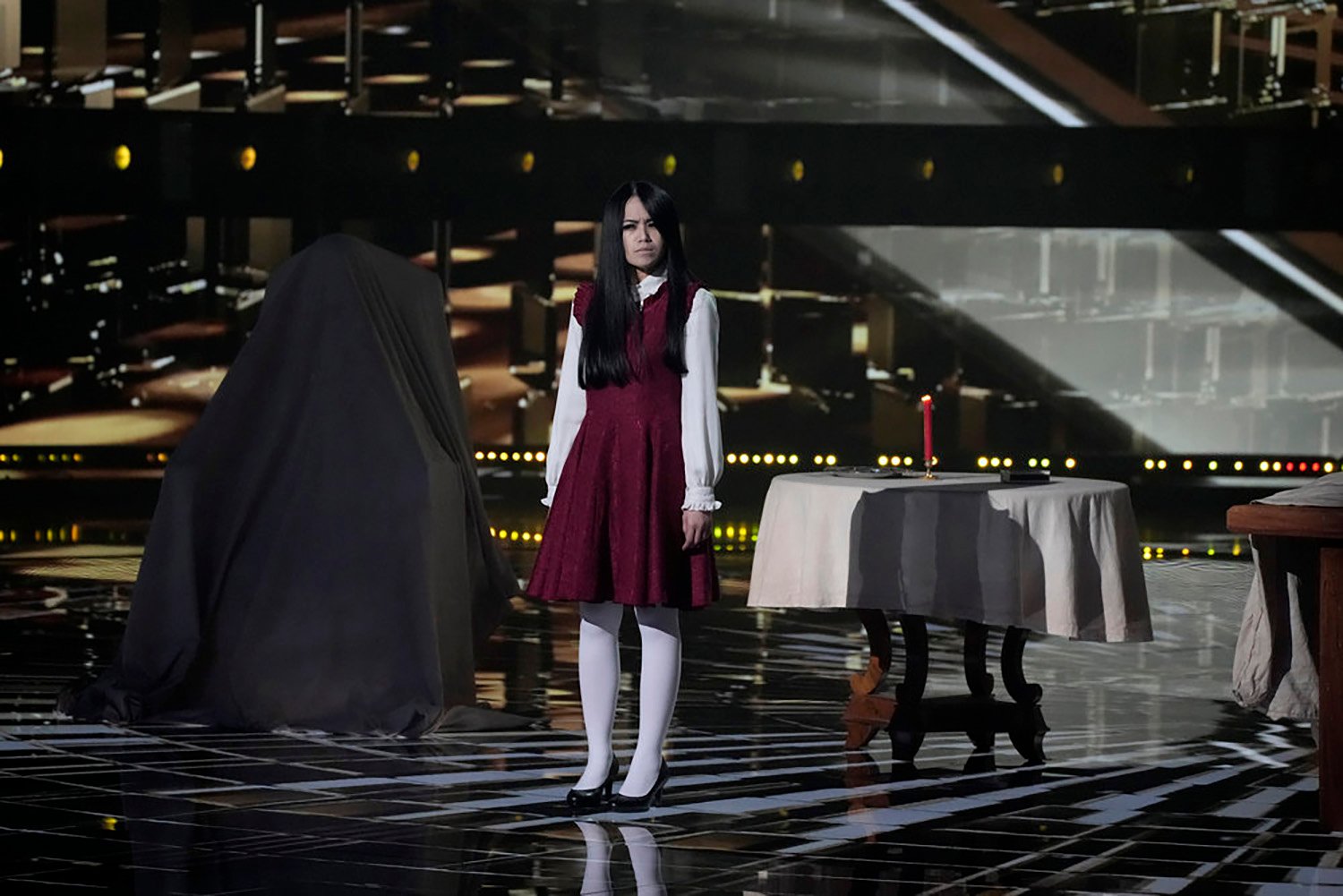 The Sacred Riana stands on stage at America's Got Talent: All-Stars