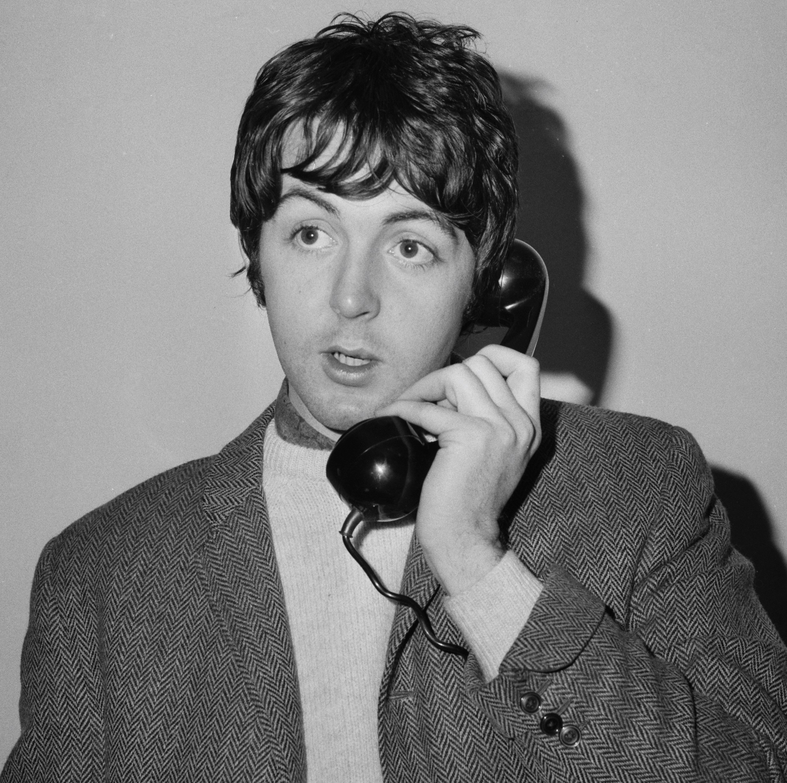 Paul McCartney with a phone during The Beatles' "All My Loving" era