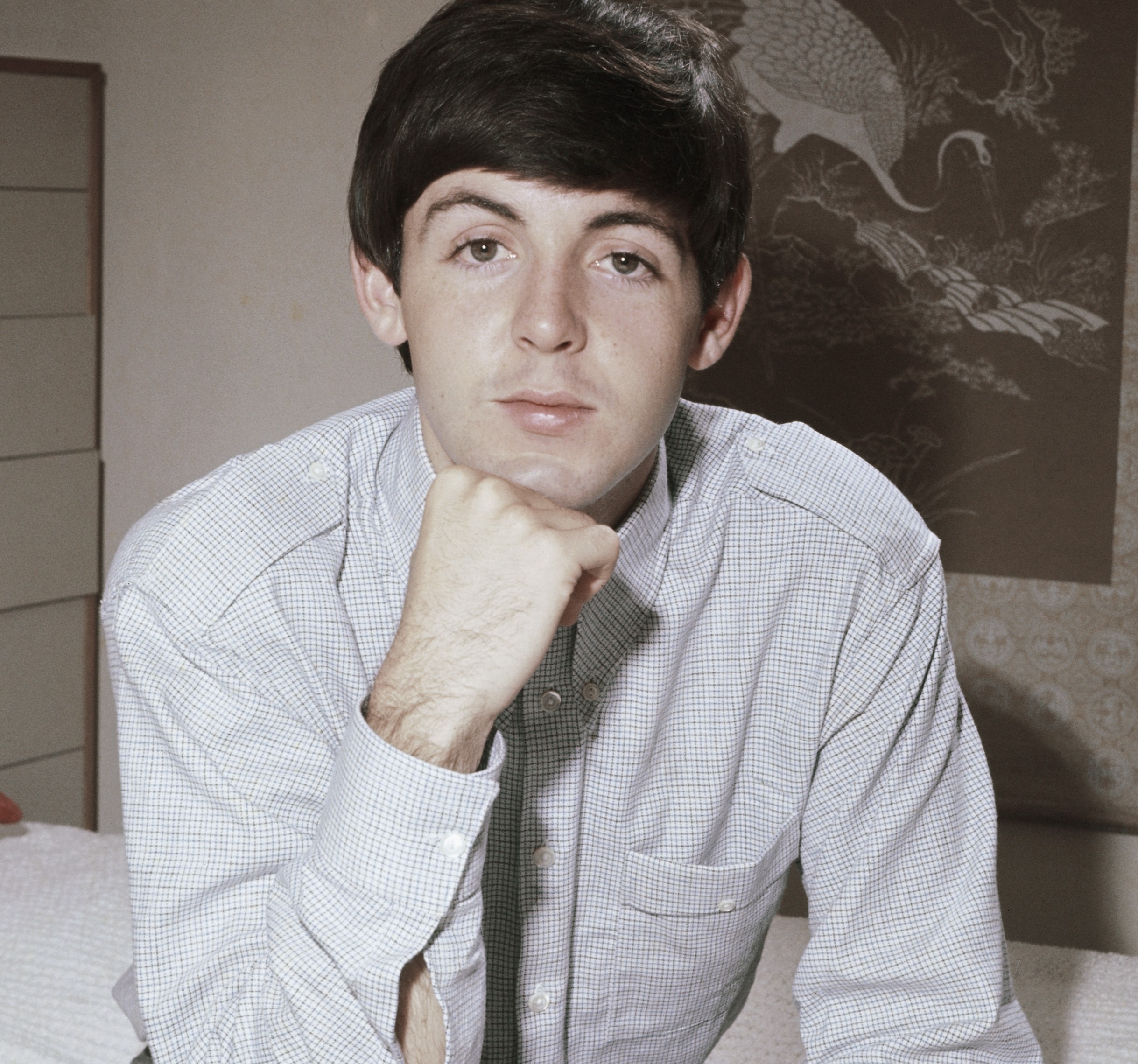 Paul McCartney with his head on his hand