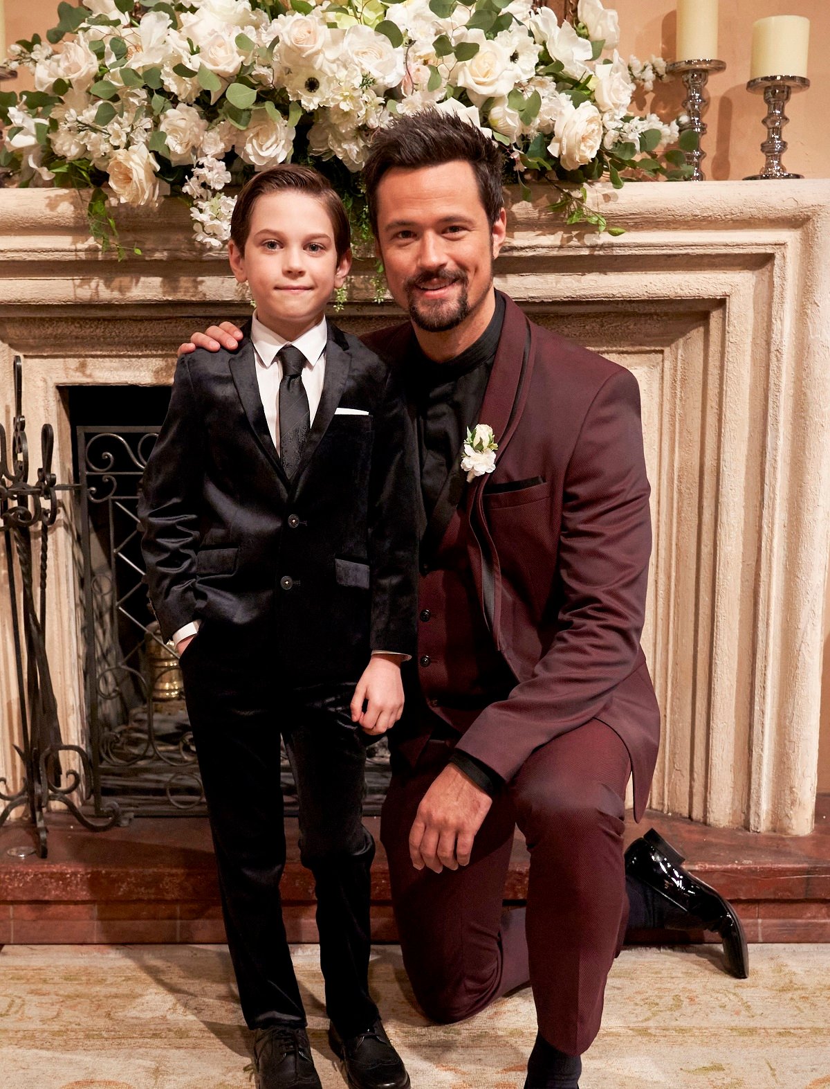 'The Bold and the Beautiful' stars Henry Joseph Samiri and Matthew Atkinson; dressed in suits posing together on set.