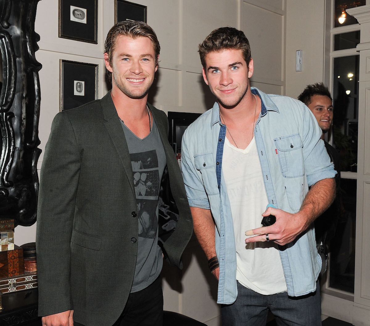Actors Chris Hemsworth and Liam Hemsworth at a party in 2011
