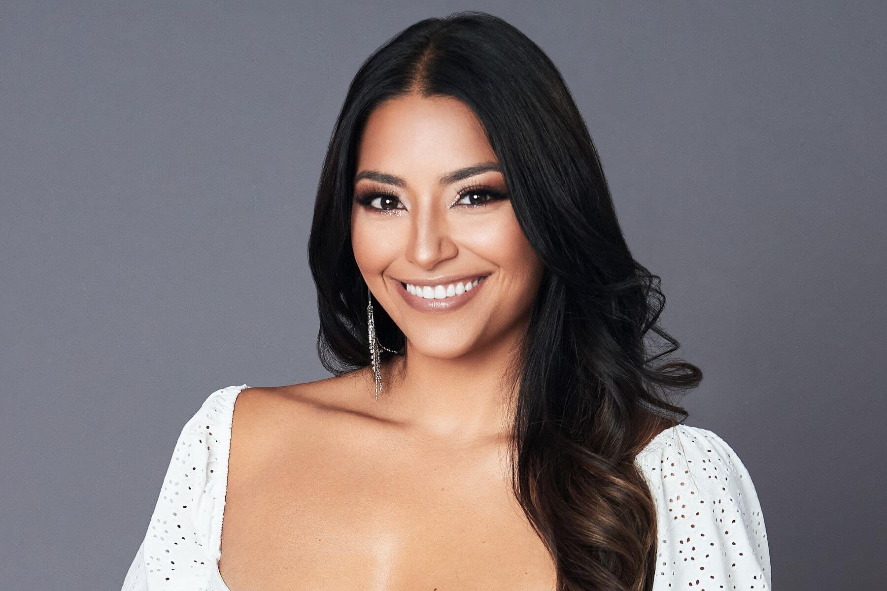 Anissa Aguilar, who is a part of the 'Are You the One?' Season 9 cast, wears a white top in her promotional photo for the show.