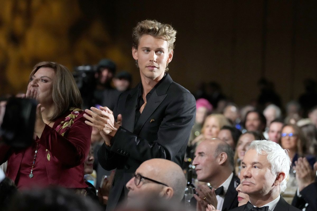 Austin Butler stands up in a crowd.