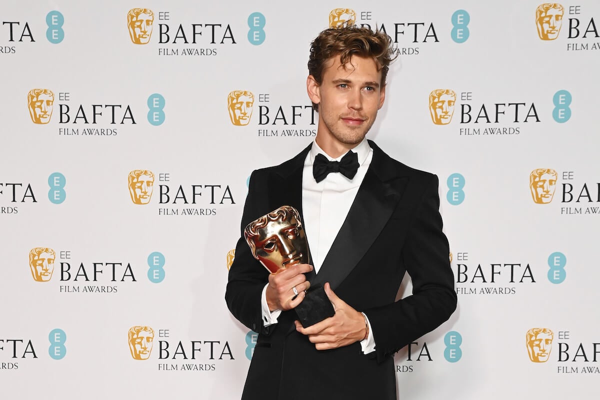 Austin Butler holding an award