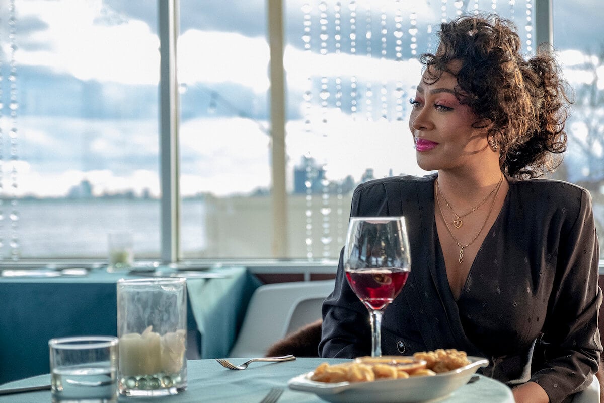 La La Anthony as Markisha Taylor on 'BMF' having dinner on the water