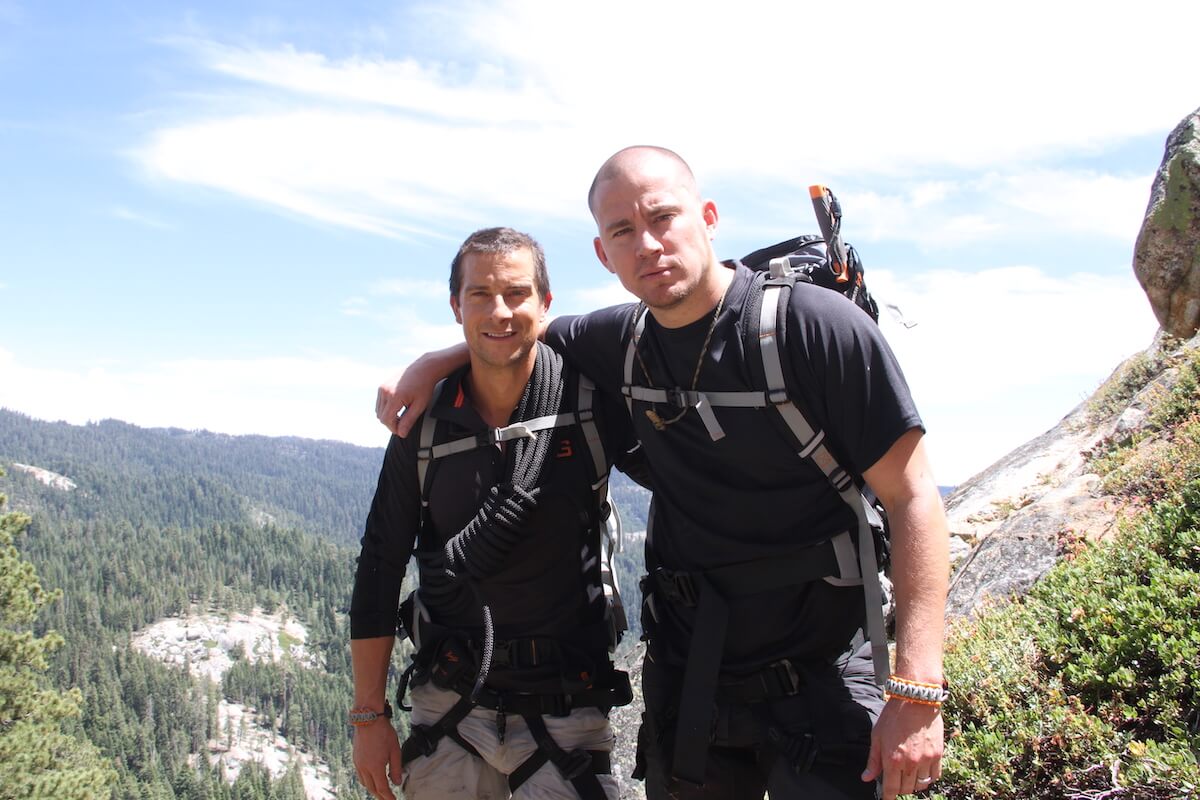 Bear Grylls and Channing Tatum outside with backpacks