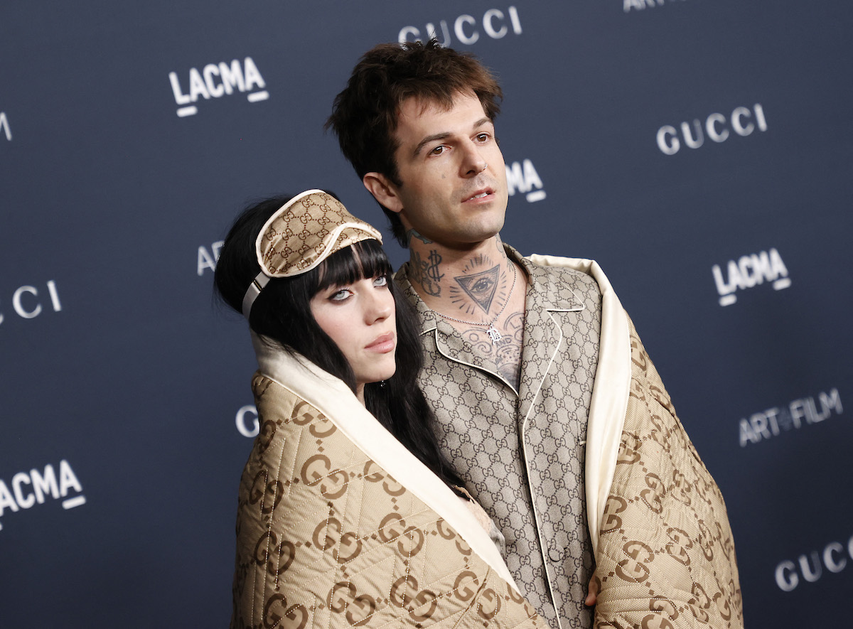 Billie Eilish and Jesse Rutherford pose together at an event.