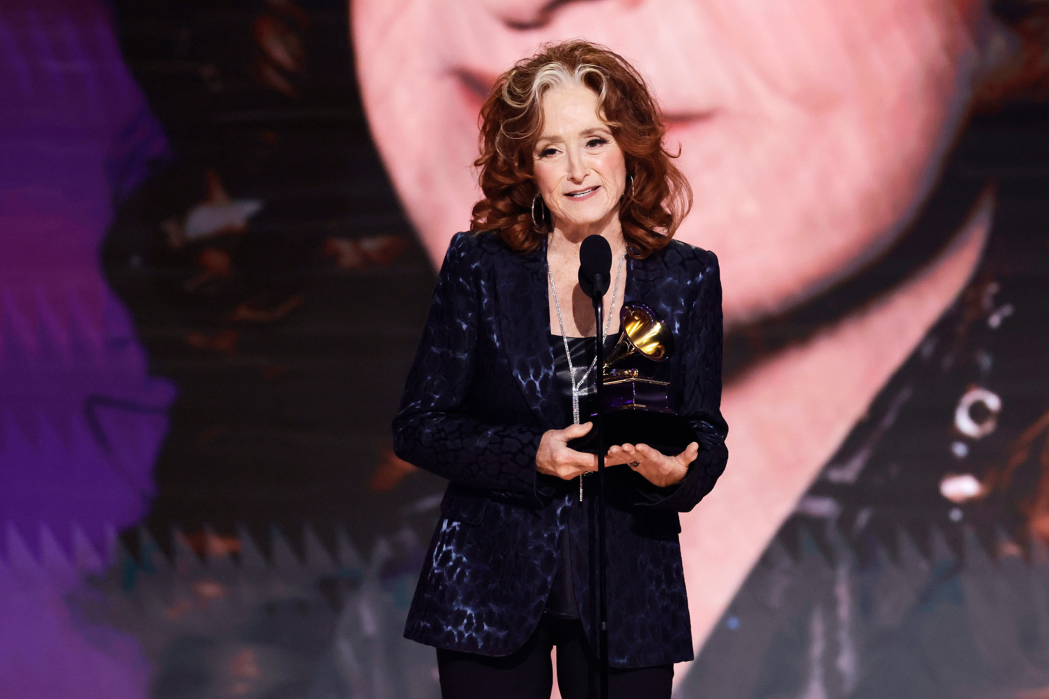 Bonnie Raitt accepts the Song Of The Year award for 'Just Like That' during the 65th GRAMMY Awards