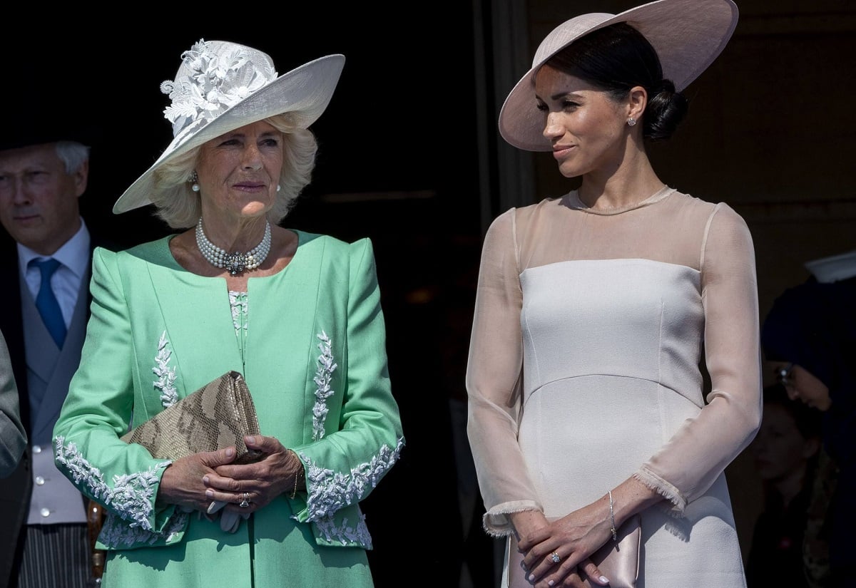 Camilla Parker Bowles and Meghan Markle, whose engagement rings share a resemblance, standing side by side during then-Prince Charles' 70th Birthday Patronage Celebration