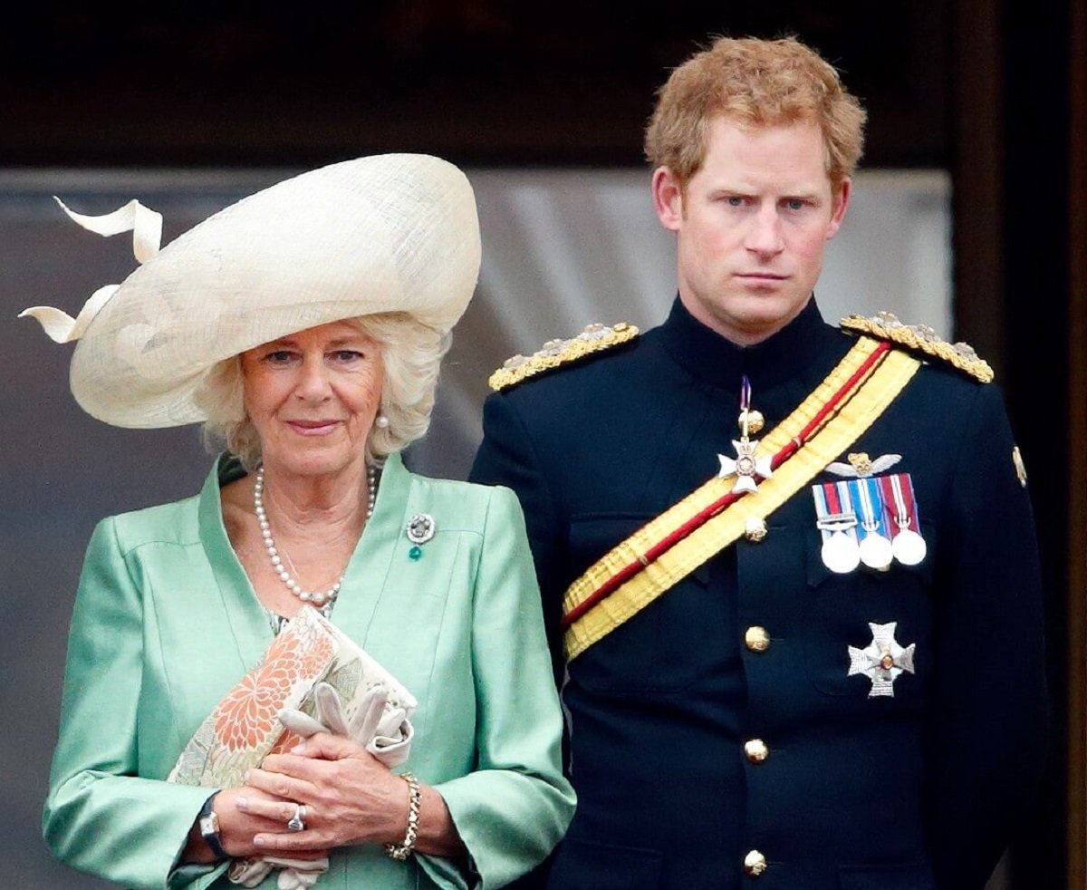 Camilla Parker Bowles and Prince Harry standing on the balcony of Buckingham Palace during Trooping the Colour
