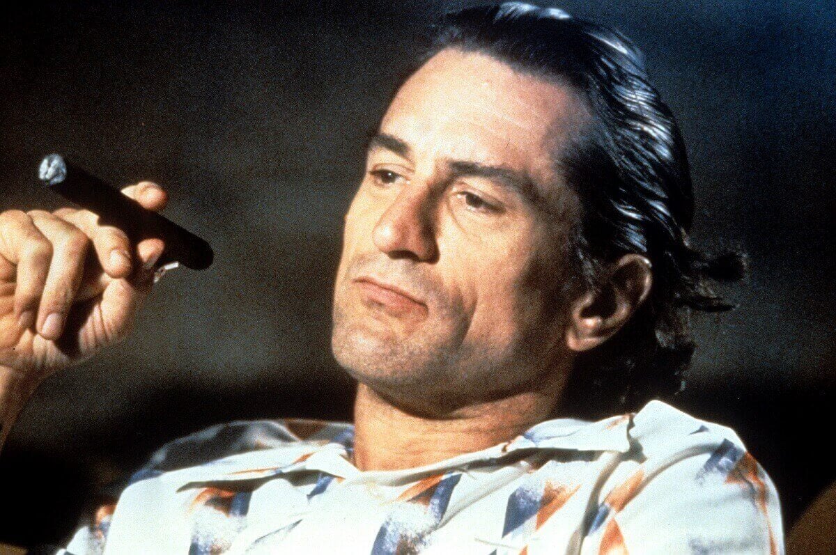 Robert De Niro smokes a cigar in a scene from the film 'Cape Fear'