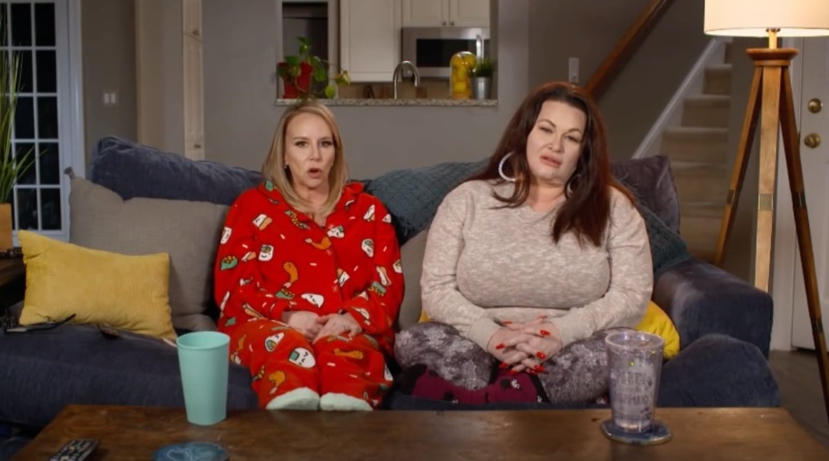 Cynthia Decker and Molly Hopkins sitting on a couch during '90 Day Fiancé: Pillow Talk' on TLC.